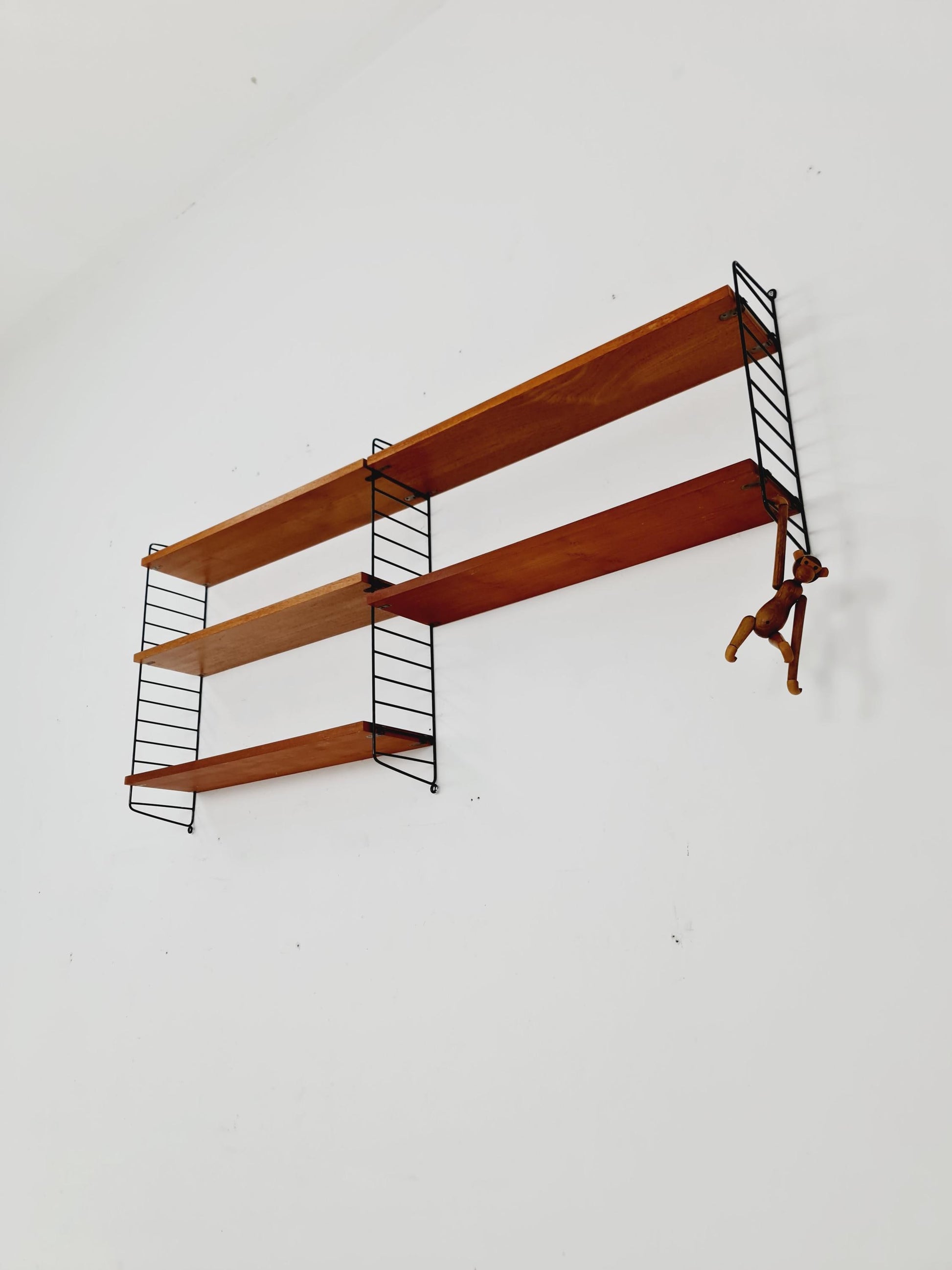 Original MCM Teak shelving system - consists of black lacquered metal ladders, from string Stockholm 1960s