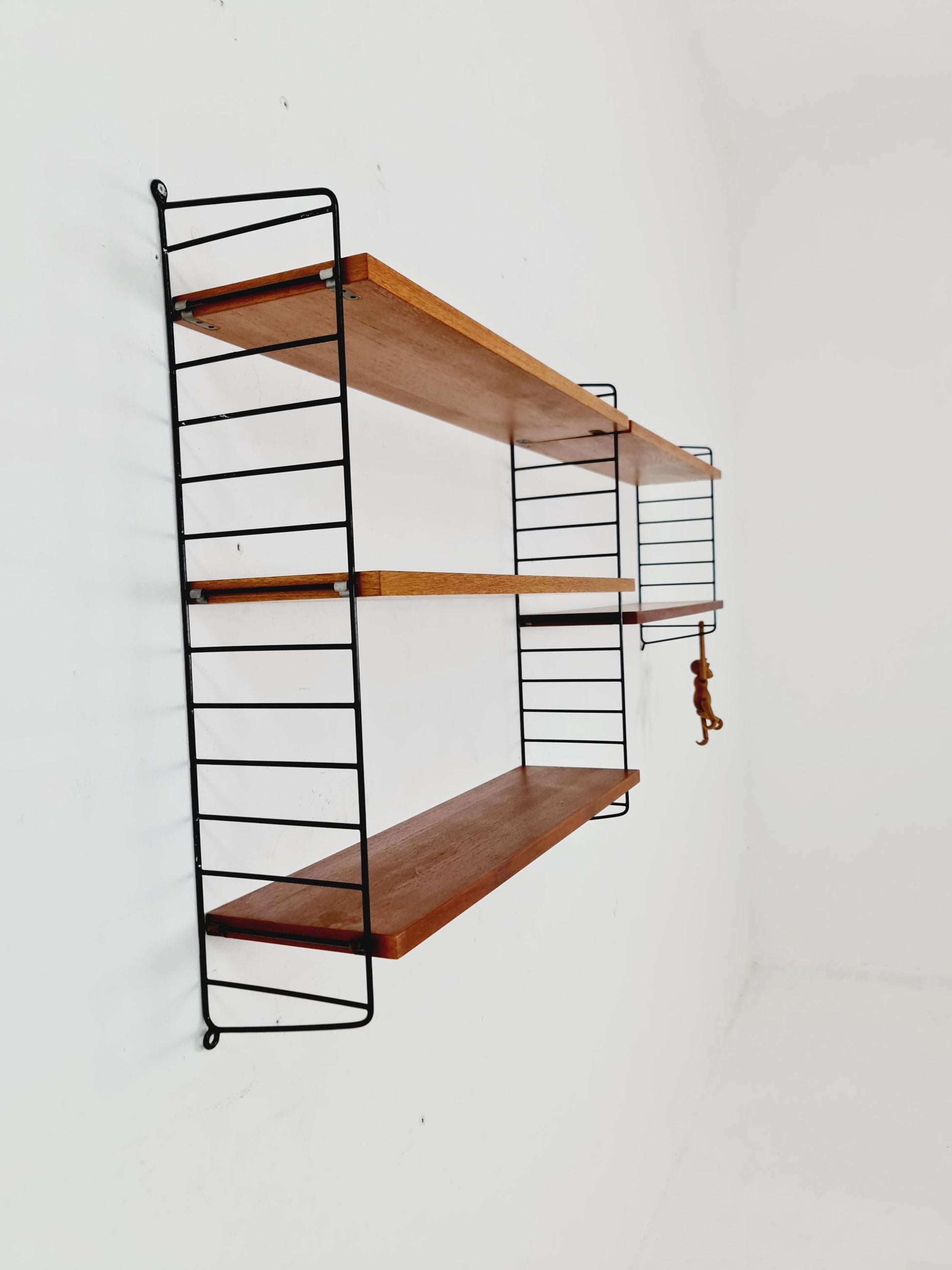 Original MCM Teak shelving system - consists of black lacquered metal ladders, from string Stockholm 1960s