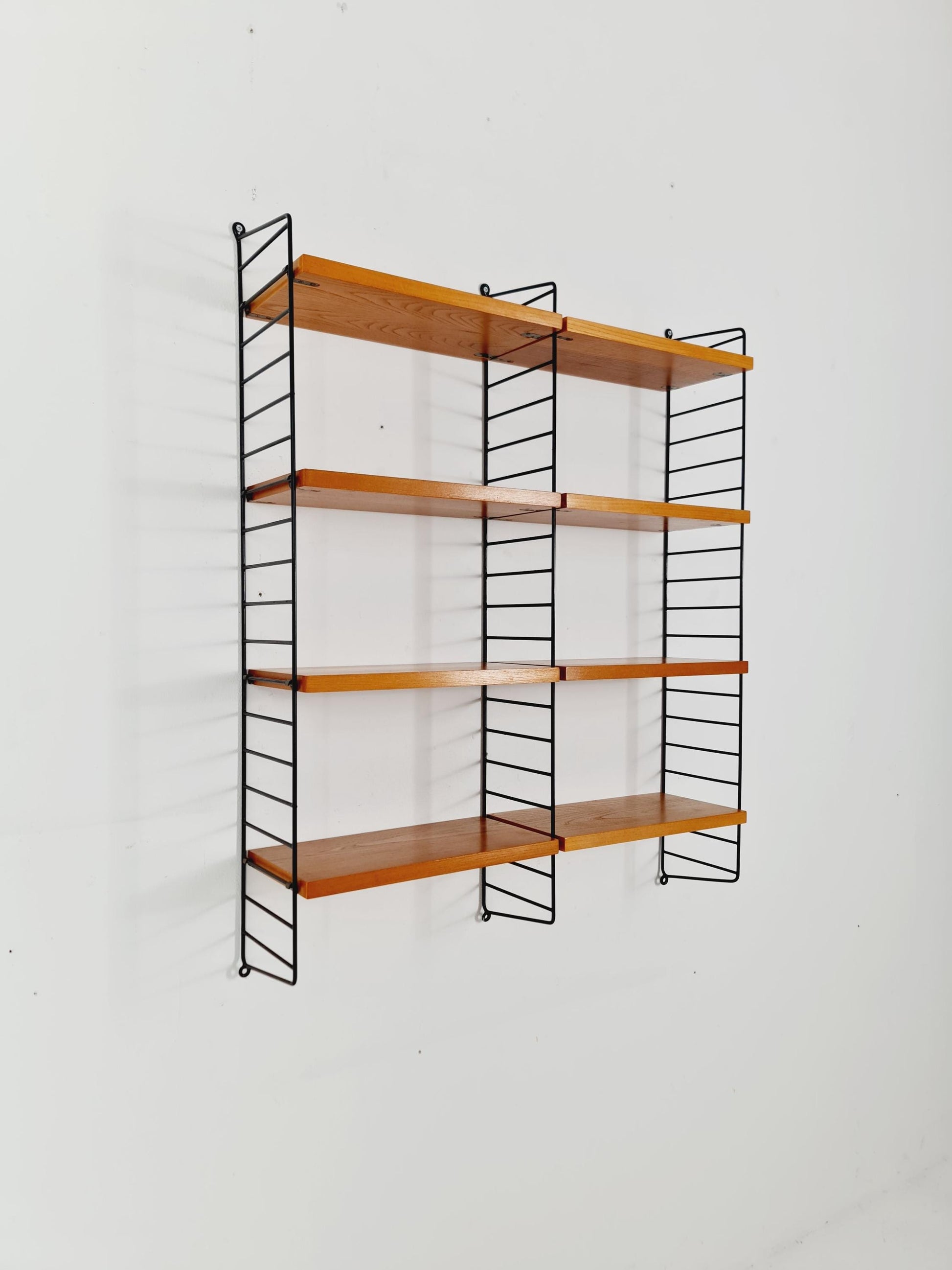 Original MCM Ash shelving system - consists of black lacquered metal ladders, from string Stockholm 1960s