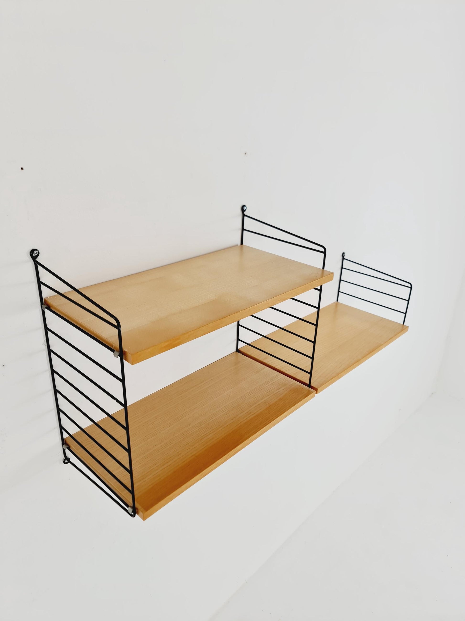 Original MCM Ash shelving system - consists of Black lacquered metal ladders, from string Stockholm 1960s