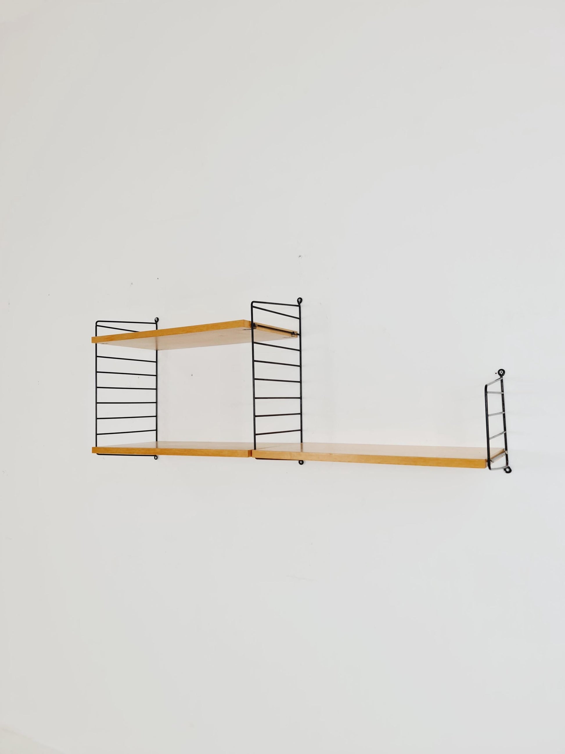 Original MCM Ash shelving system - consists of Black lacquered metal ladders, from string Stockholm 1960s