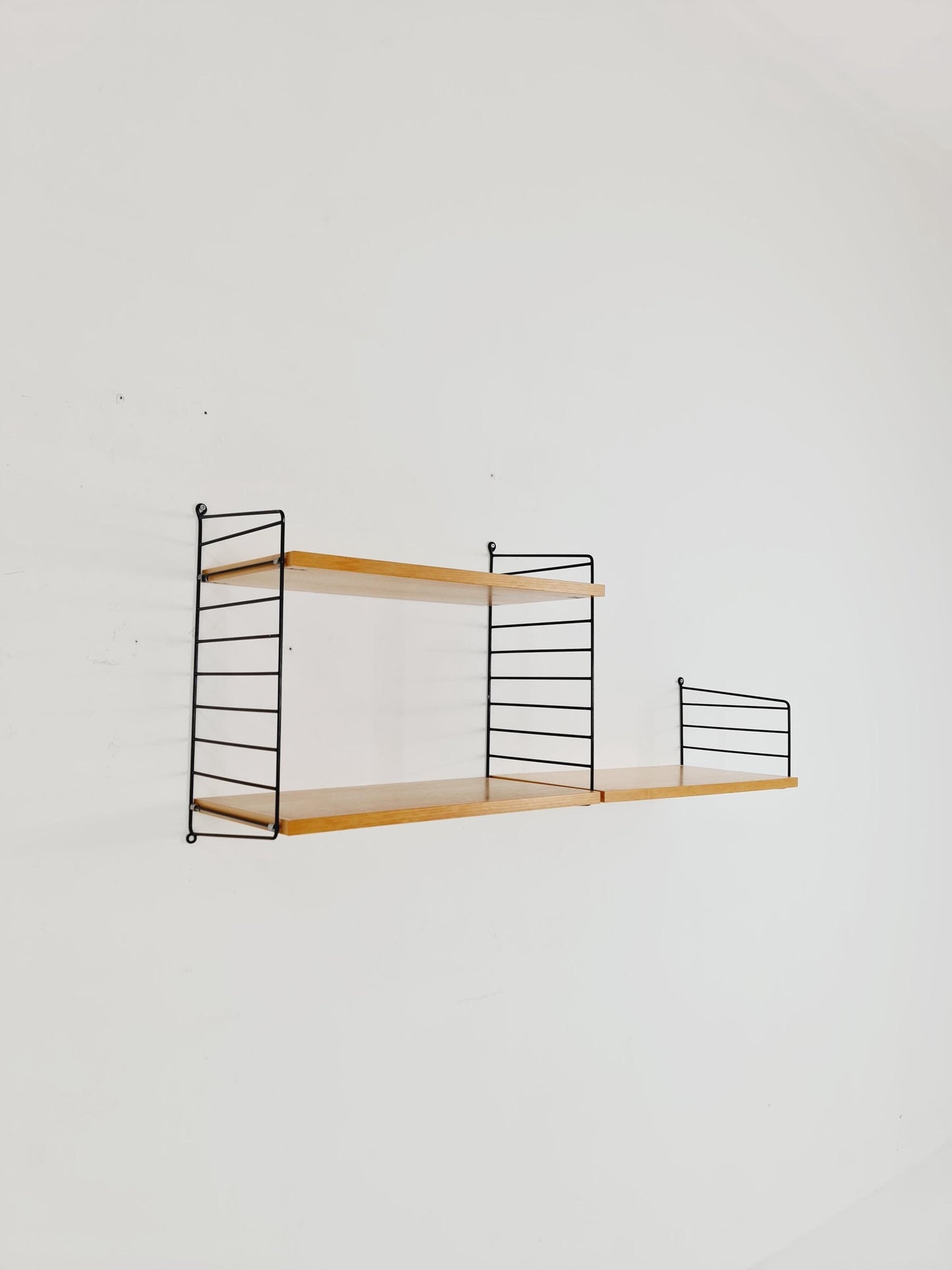Original MCM Ash shelving system - consists of Black lacquered metal ladders, from string Stockholm 1960s