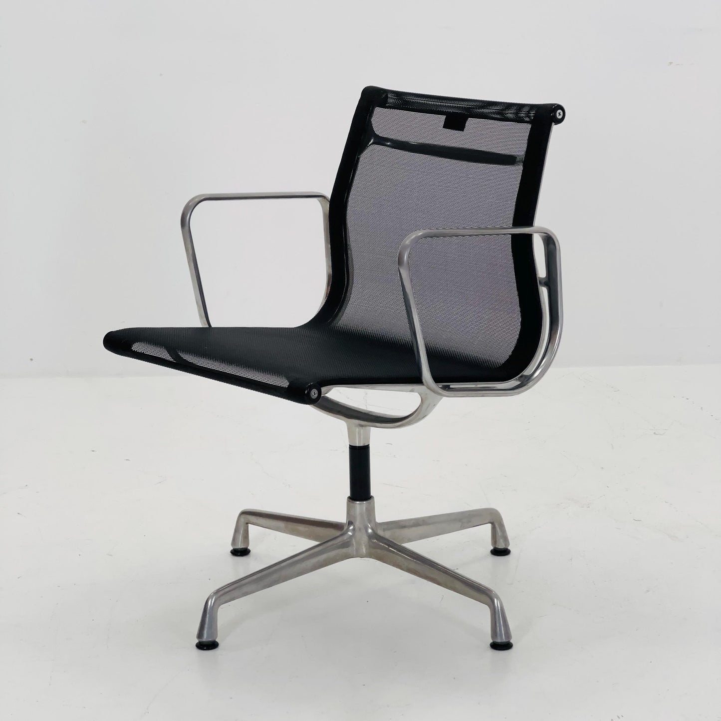 Mid century Eames EA 108 office chair by Vitra with black mesh and polished aluminum 1960s