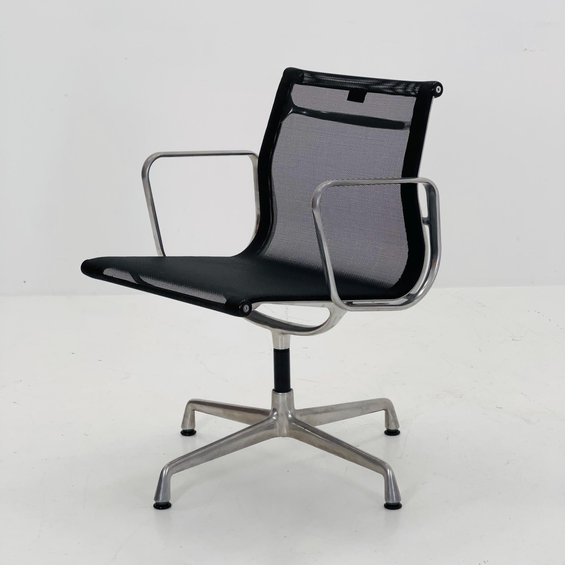 Mid century Eames EA 108 office chair by Vitra with black mesh and polished aluminum 1960s