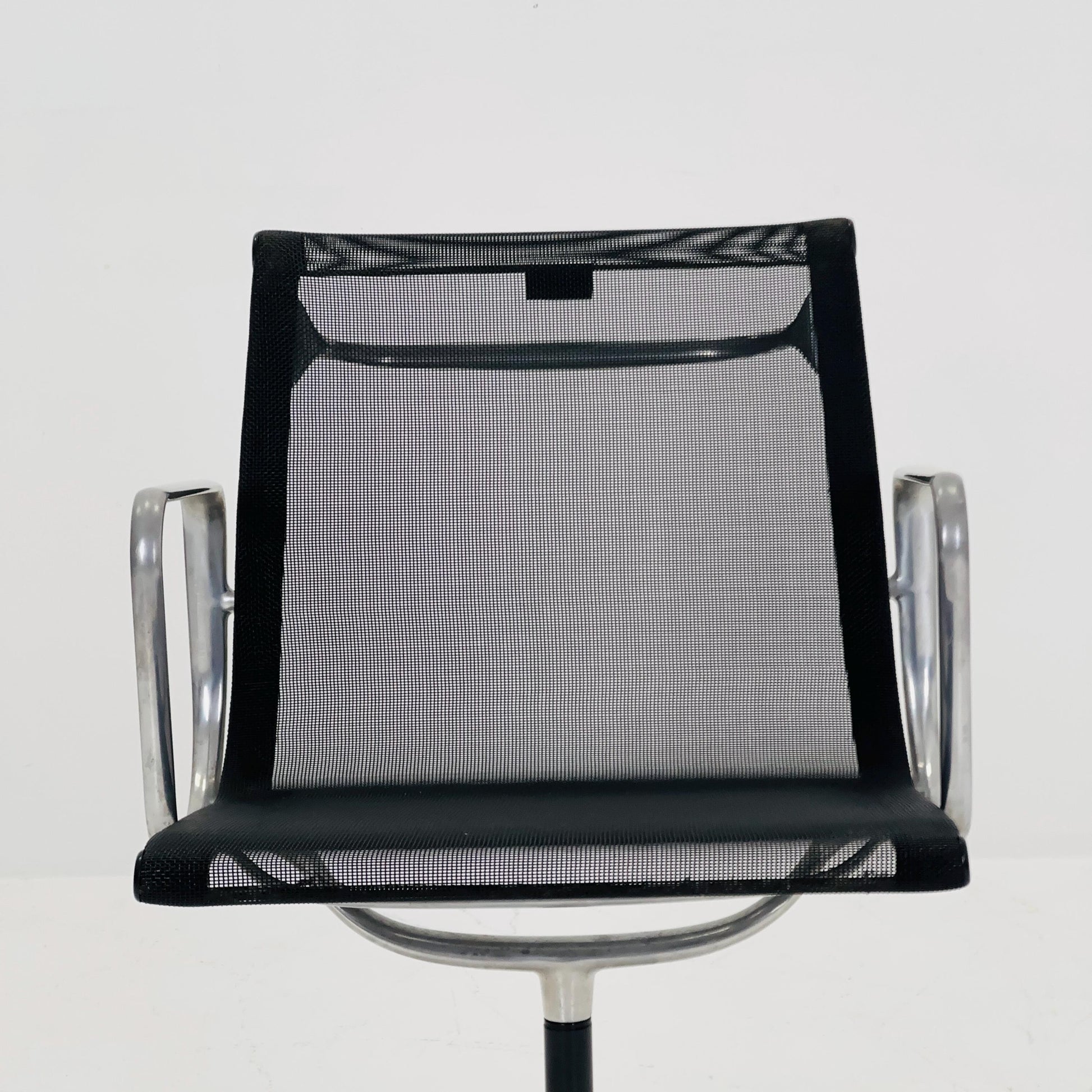 Mid century Eames EA 108 office chair by Vitra with black mesh and polished aluminum 1960s