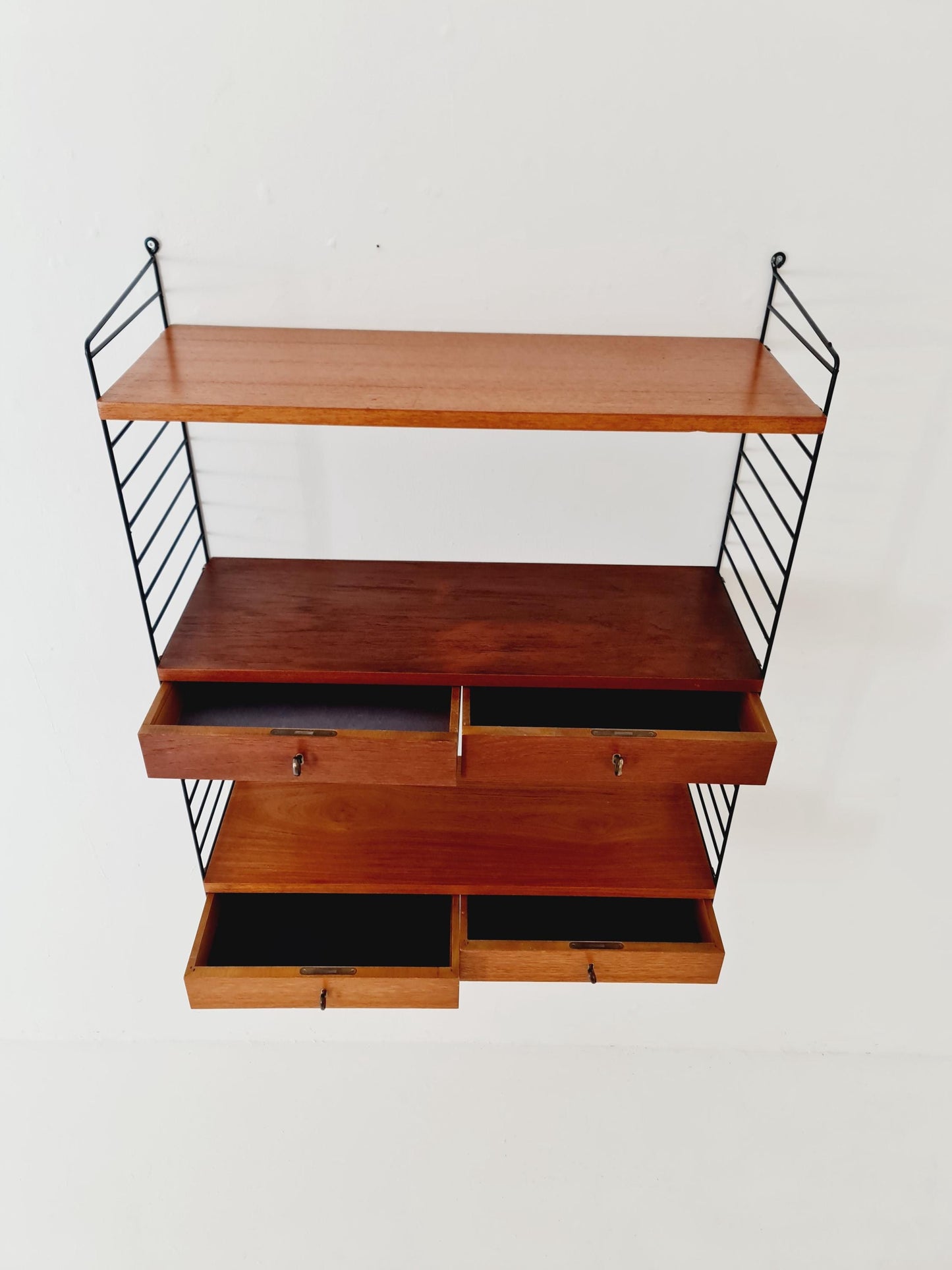 Original MCM Teak shelving system - consists of black lacquered metal ladders, from string Stockholm 1960s