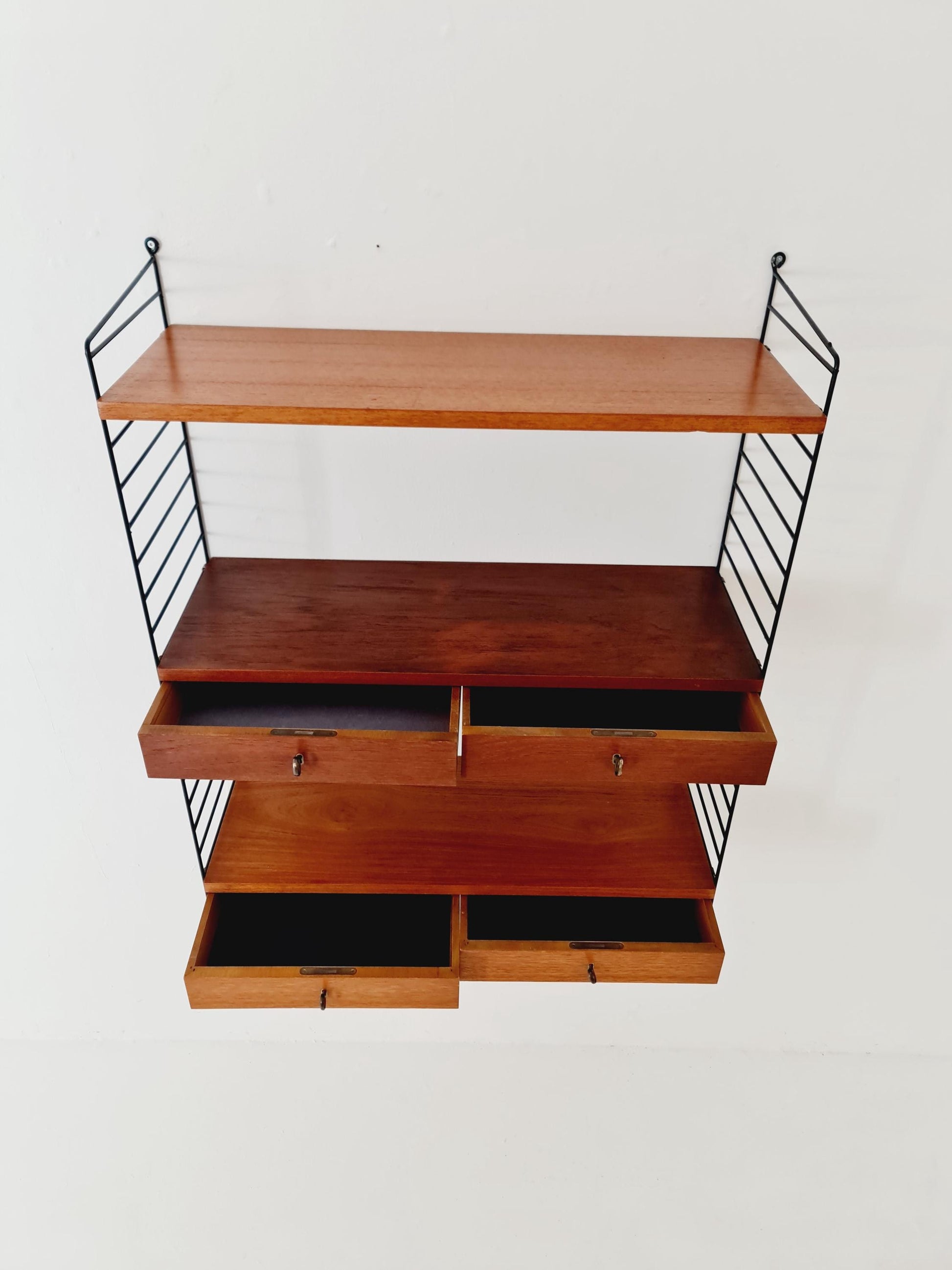 Original MCM Teak shelving system - consists of black lacquered metal ladders, from string Stockholm 1960s