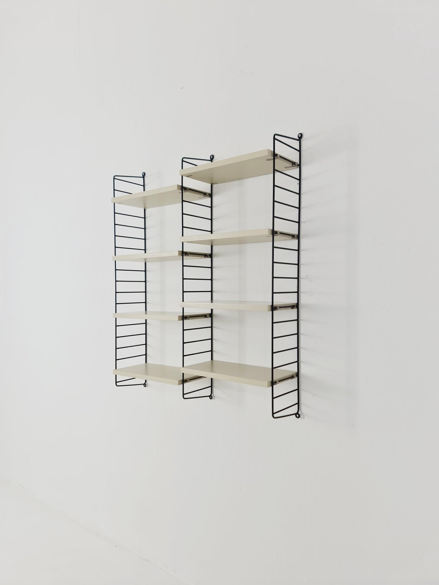 Original MCM wood shelving system - consists of black lacquered metal ladders, from string Stockholm 1960s