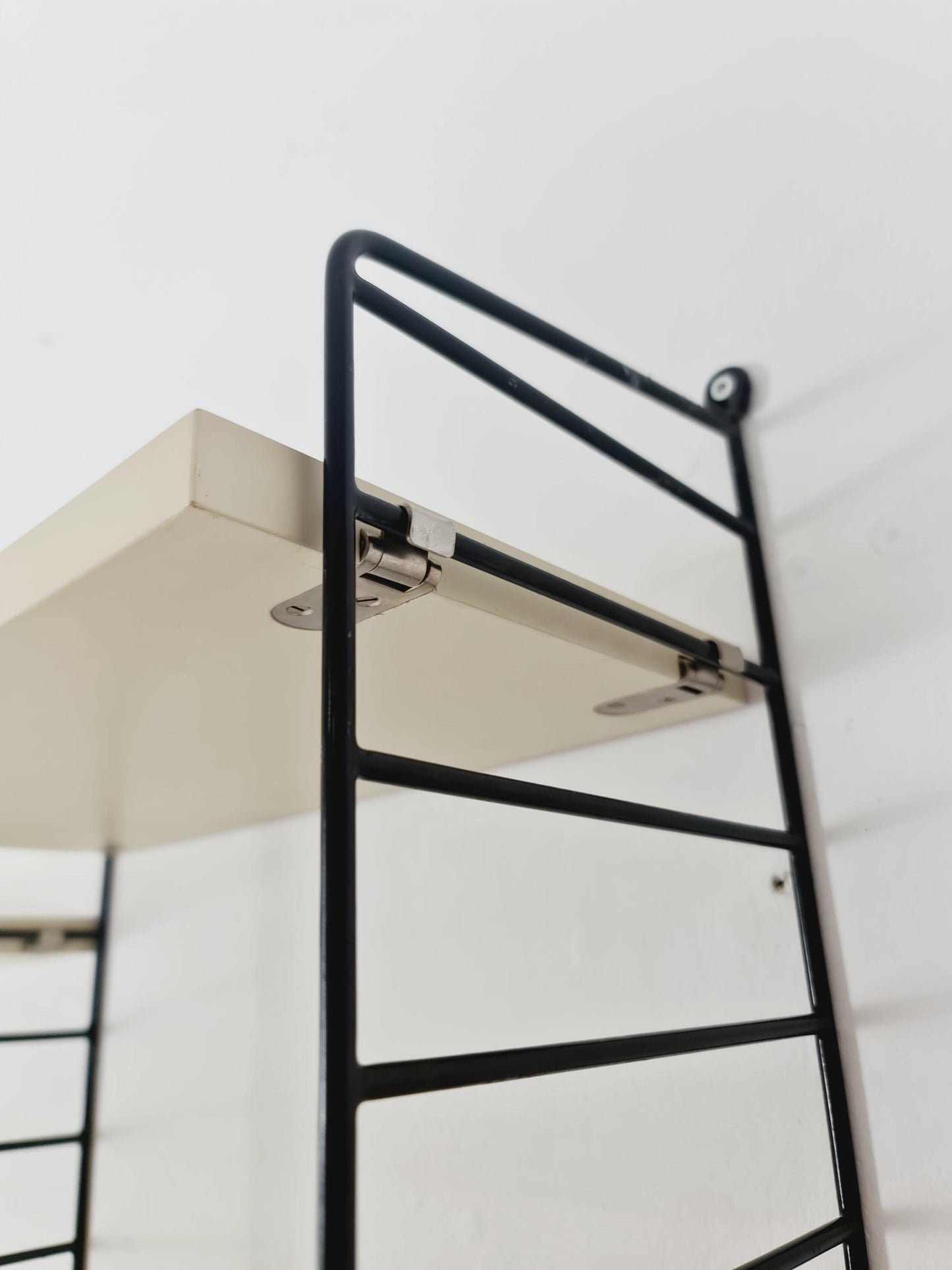 Original MCM wood shelving system - consists of black lacquered metal ladders, from string Stockholm 1960s