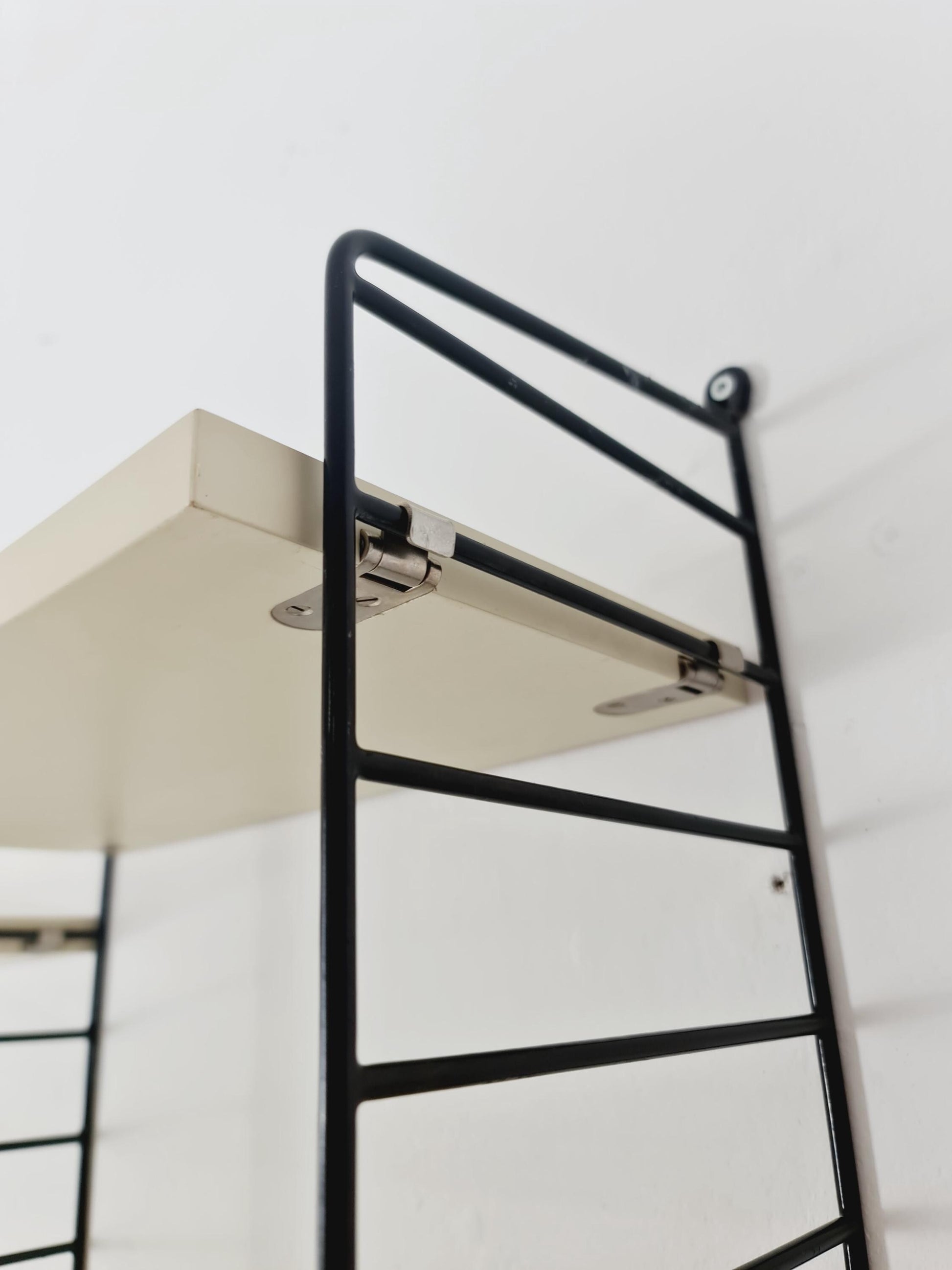 Original MCM wood shelving system - consists of black lacquered metal ladders, from string Stockholm 1960s