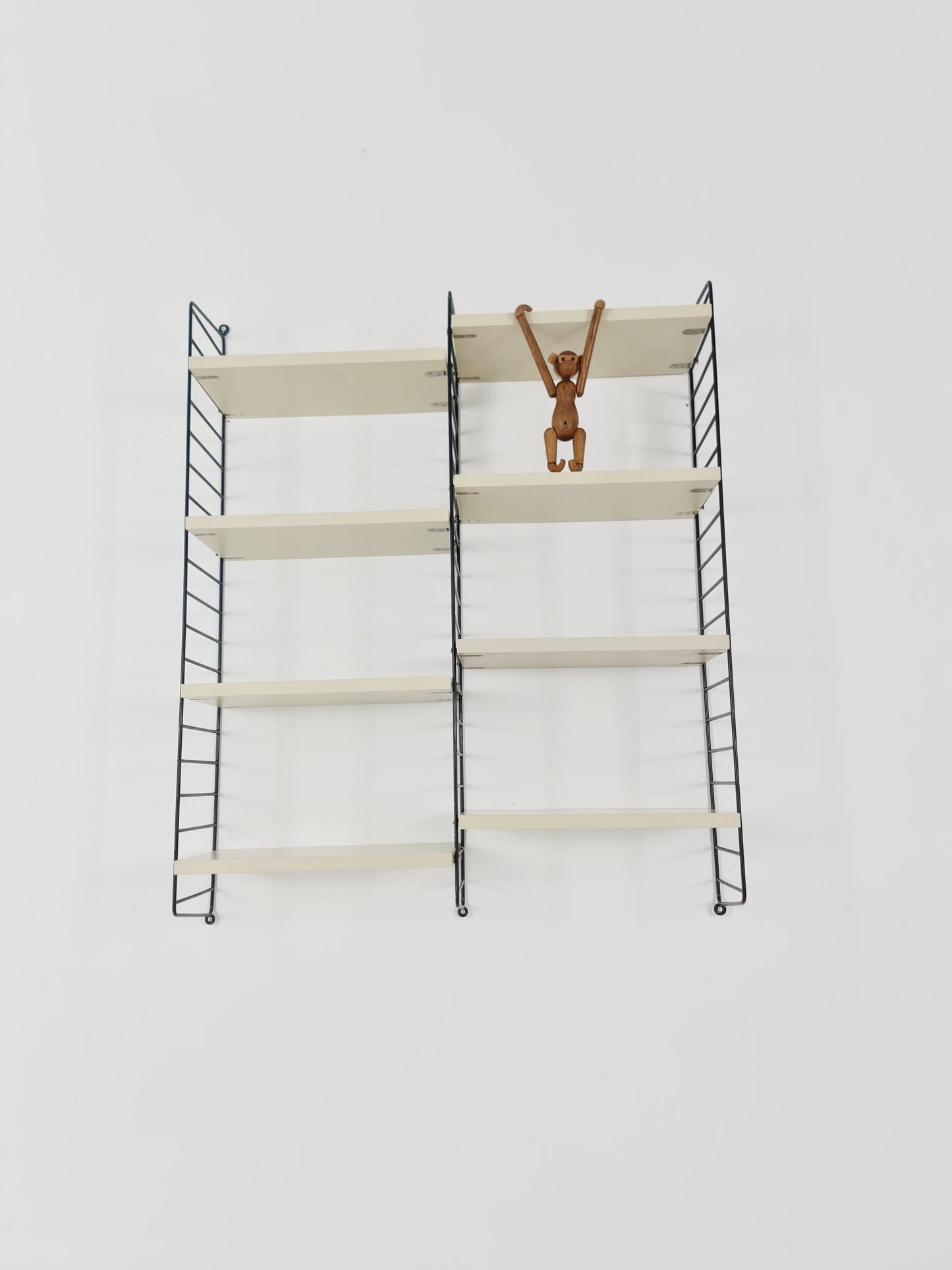 Original MCM wood shelving system - consists of black lacquered metal ladders, from string Stockholm 1960s