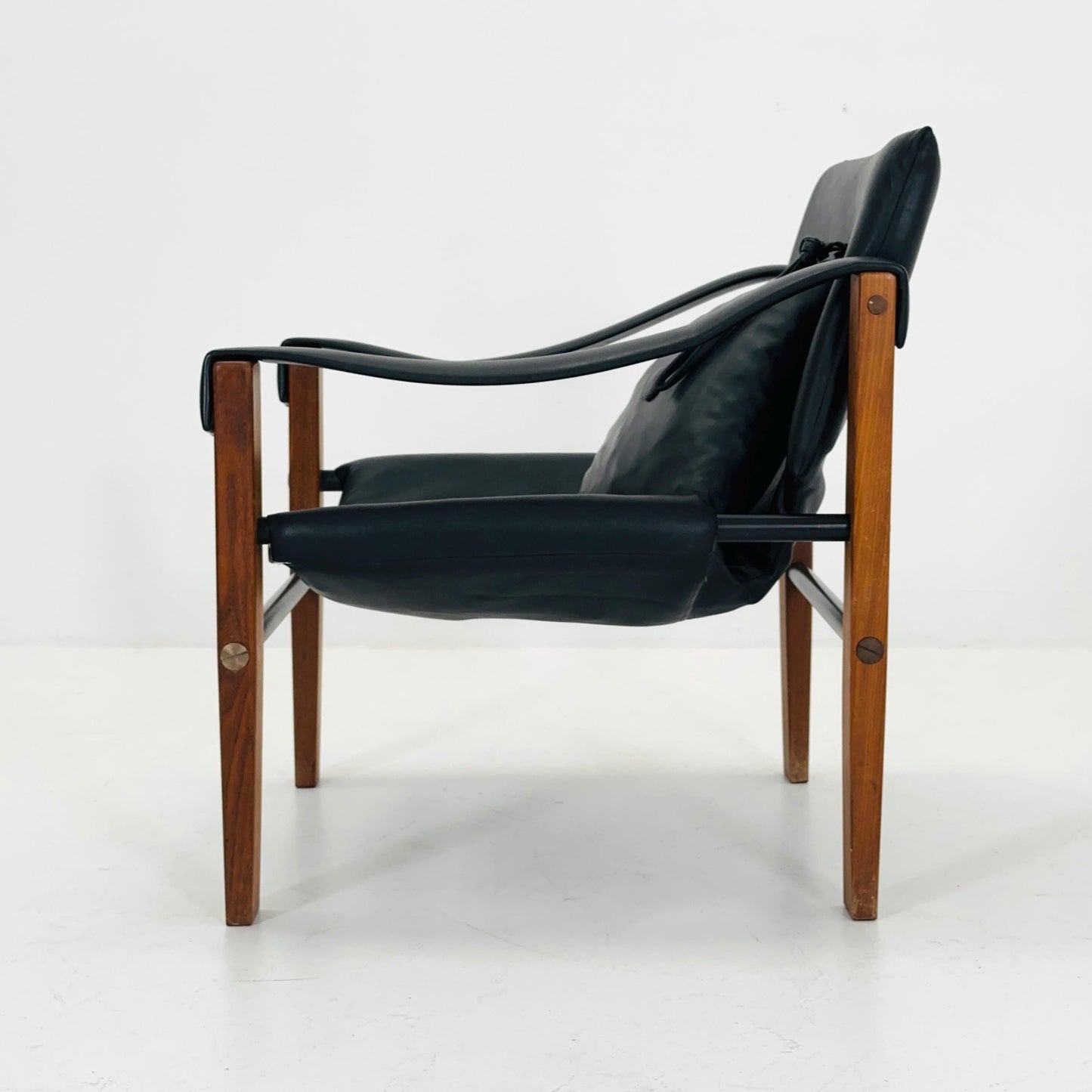 Mid century black leather Safari armchairs from Arkana by Maurice Burke, United Kingdom 1970s Scotland