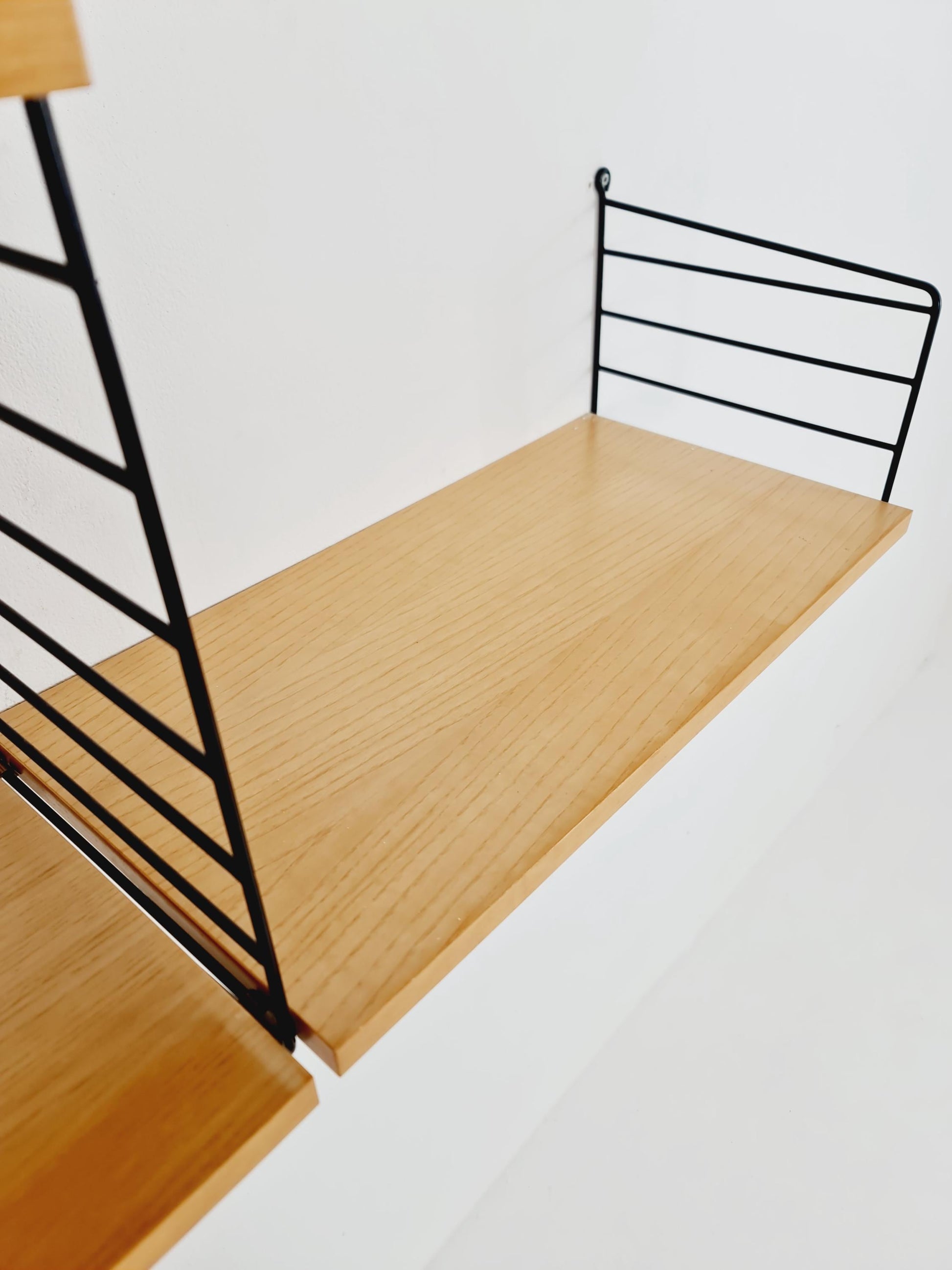 Original MCM Ash shelving system - consists of Black lacquered metal ladders, from string Stockholm 1960s