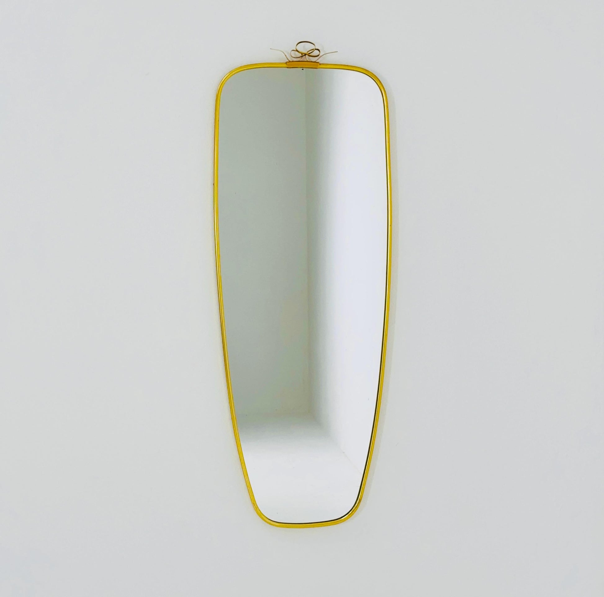 Mid Century asymmetric German brass Original kidney wall mirror from the 60s