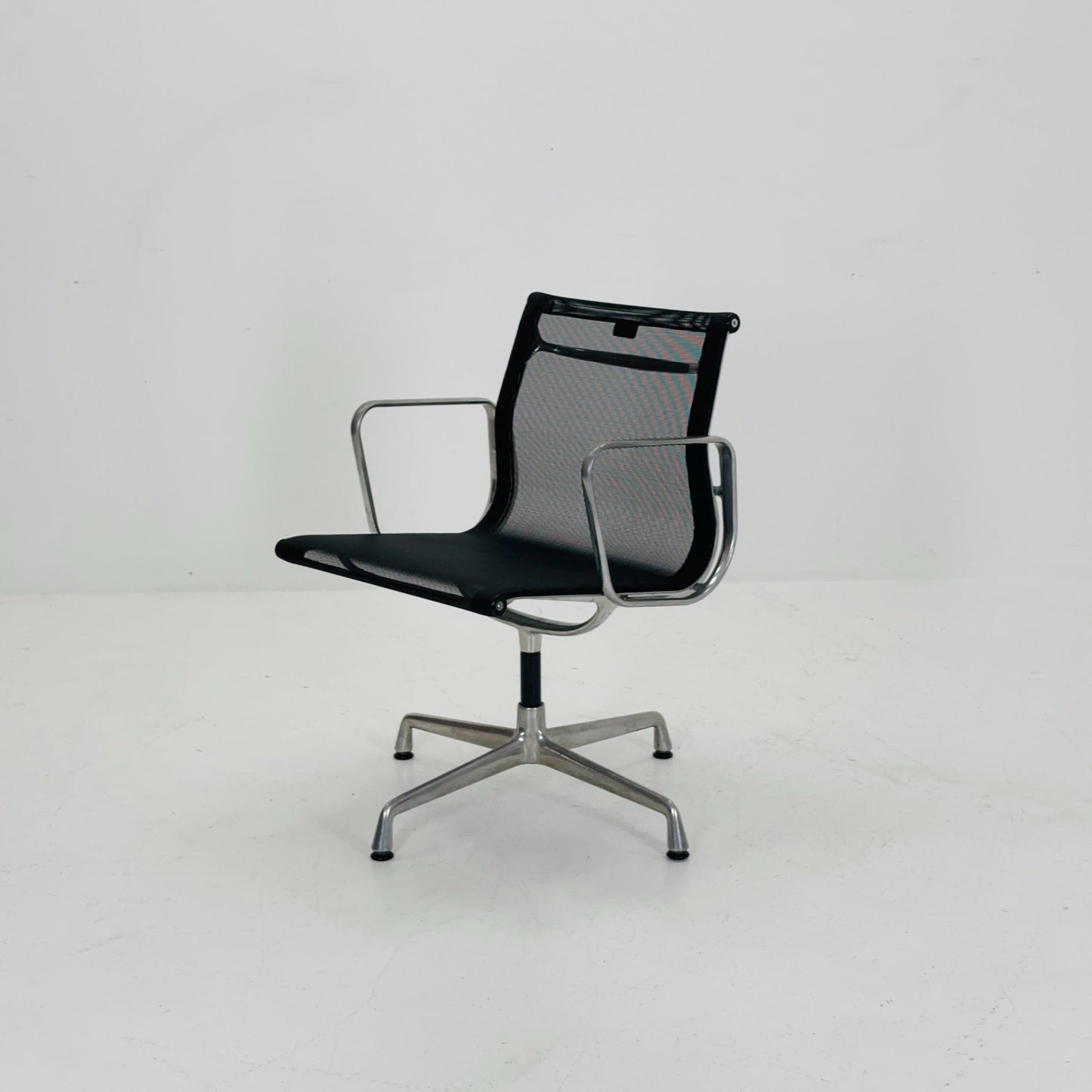 Mid century Eames EA 108 office chair by Vitra with black mesh and polished aluminum 1960s