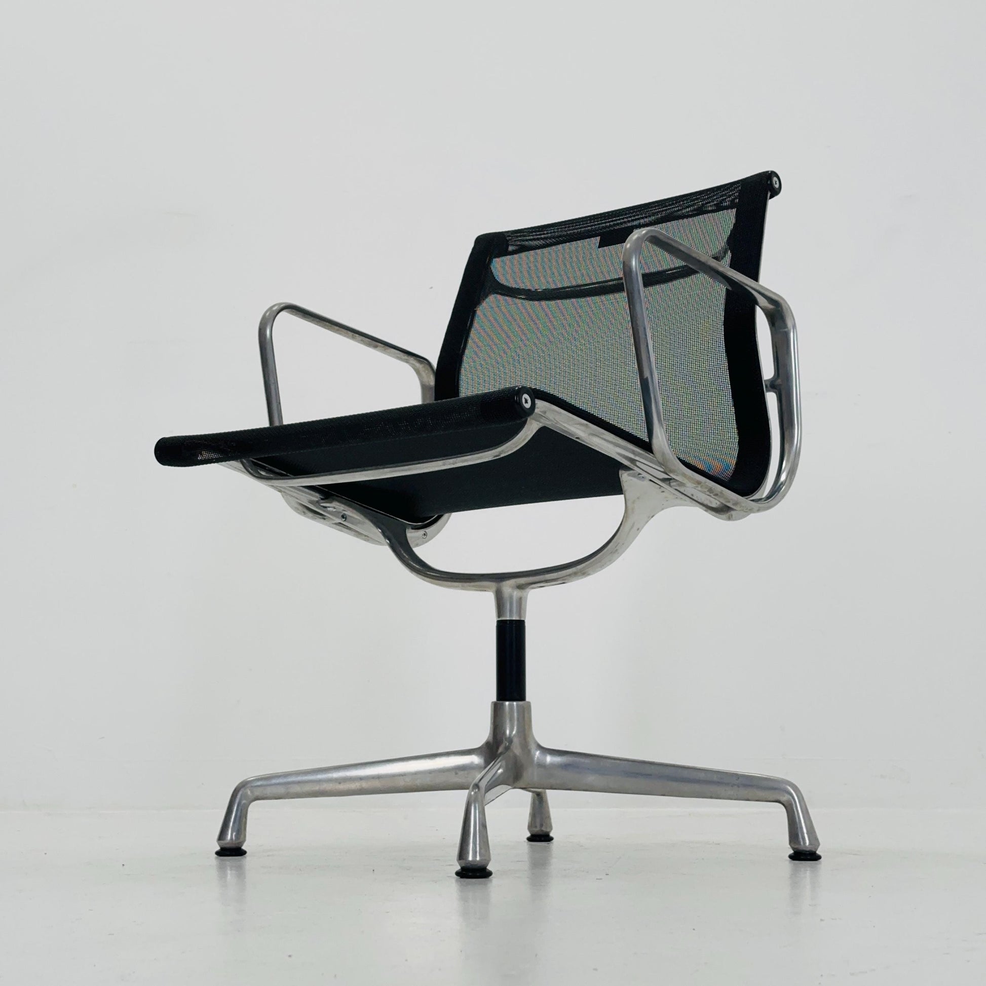 Mid century Eames EA 108 office chair by Vitra with black mesh and polished aluminum 1960s