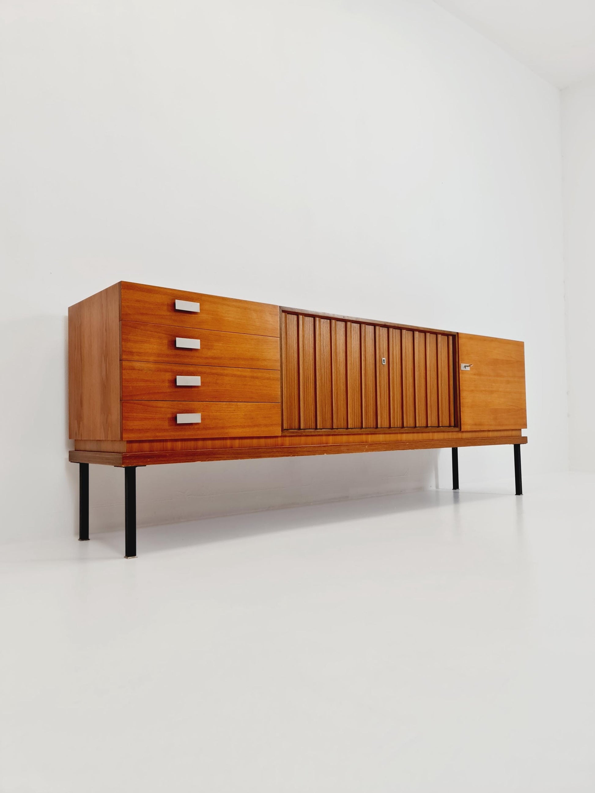 long Mid Century Modern German walnut Sideboard by Famöla Möbel , 1950s