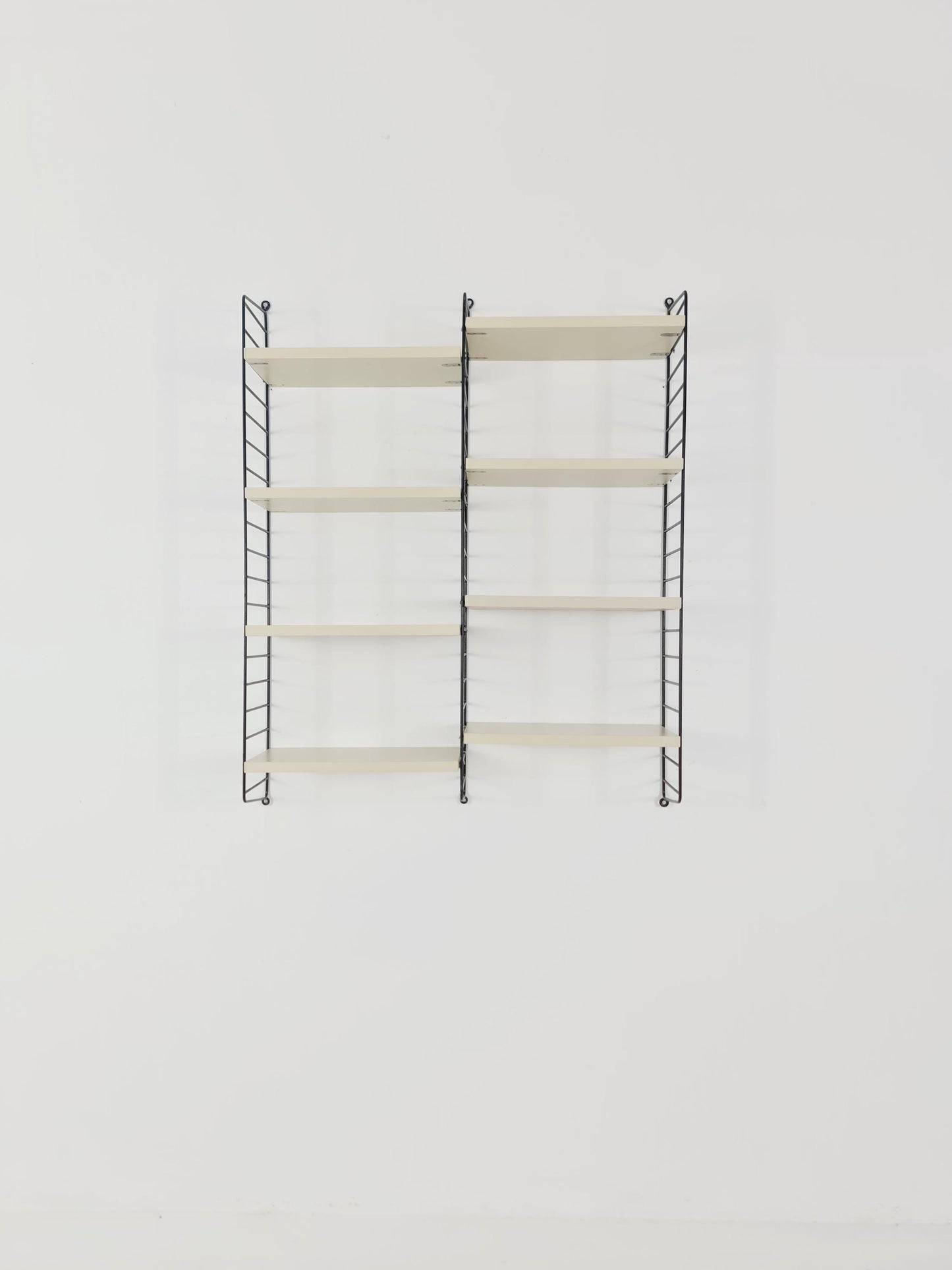 Original MCM wood shelving system - consists of black lacquered metal ladders, from string Stockholm 1960s