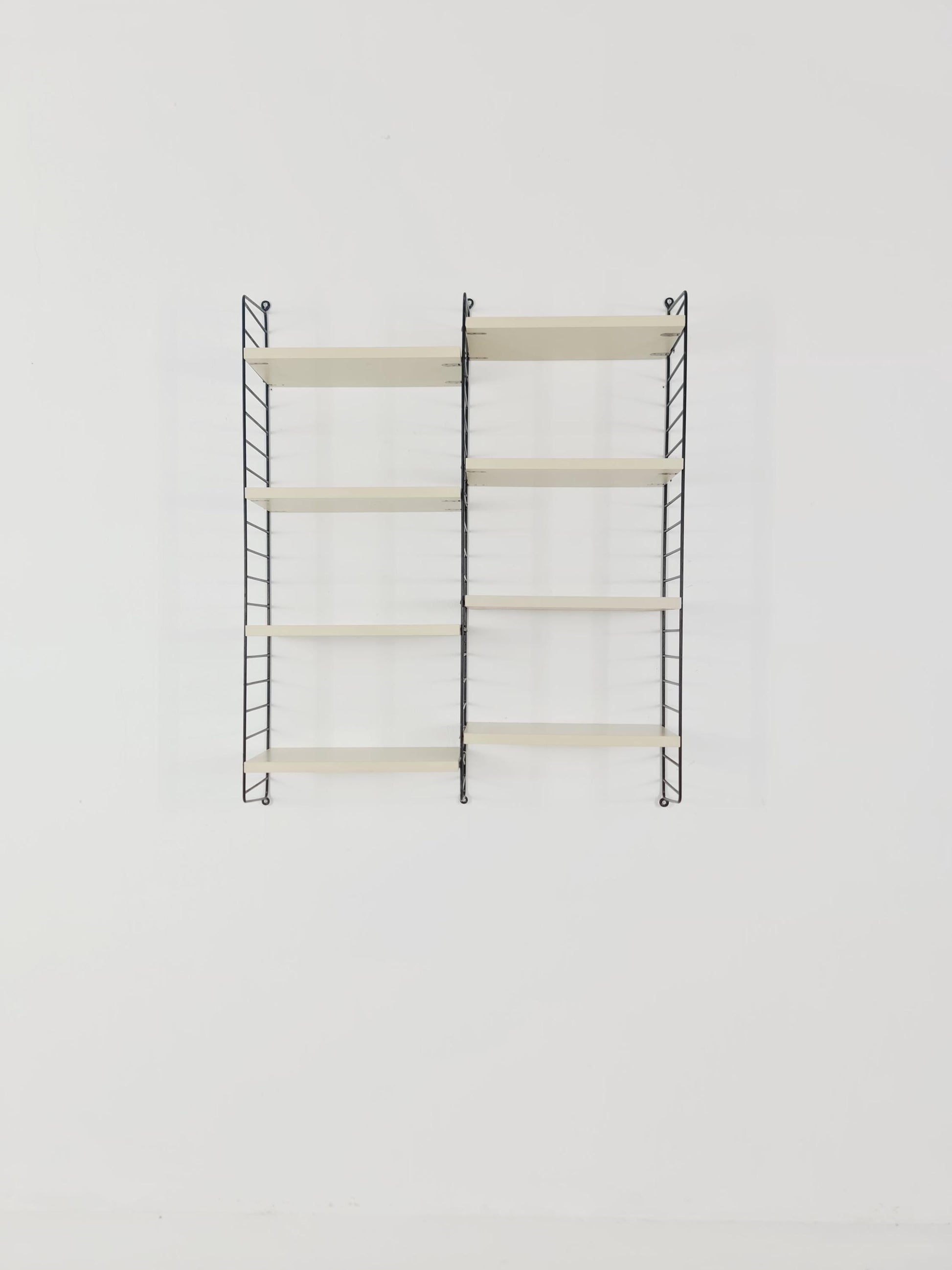Original MCM wood shelving system - consists of black lacquered metal ladders, from string Stockholm 1960s