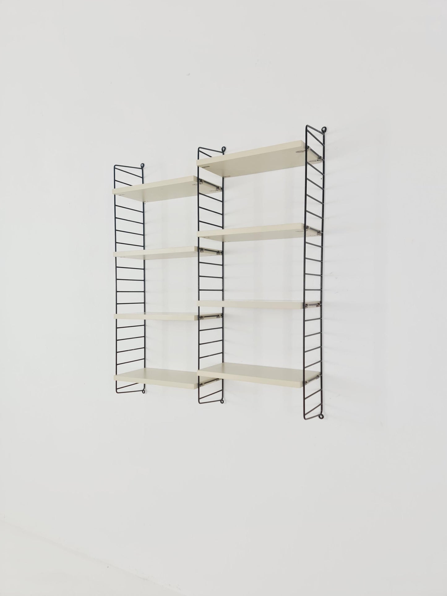 Original MCM wood shelving system - consists of black lacquered metal ladders, from string Stockholm 1960s