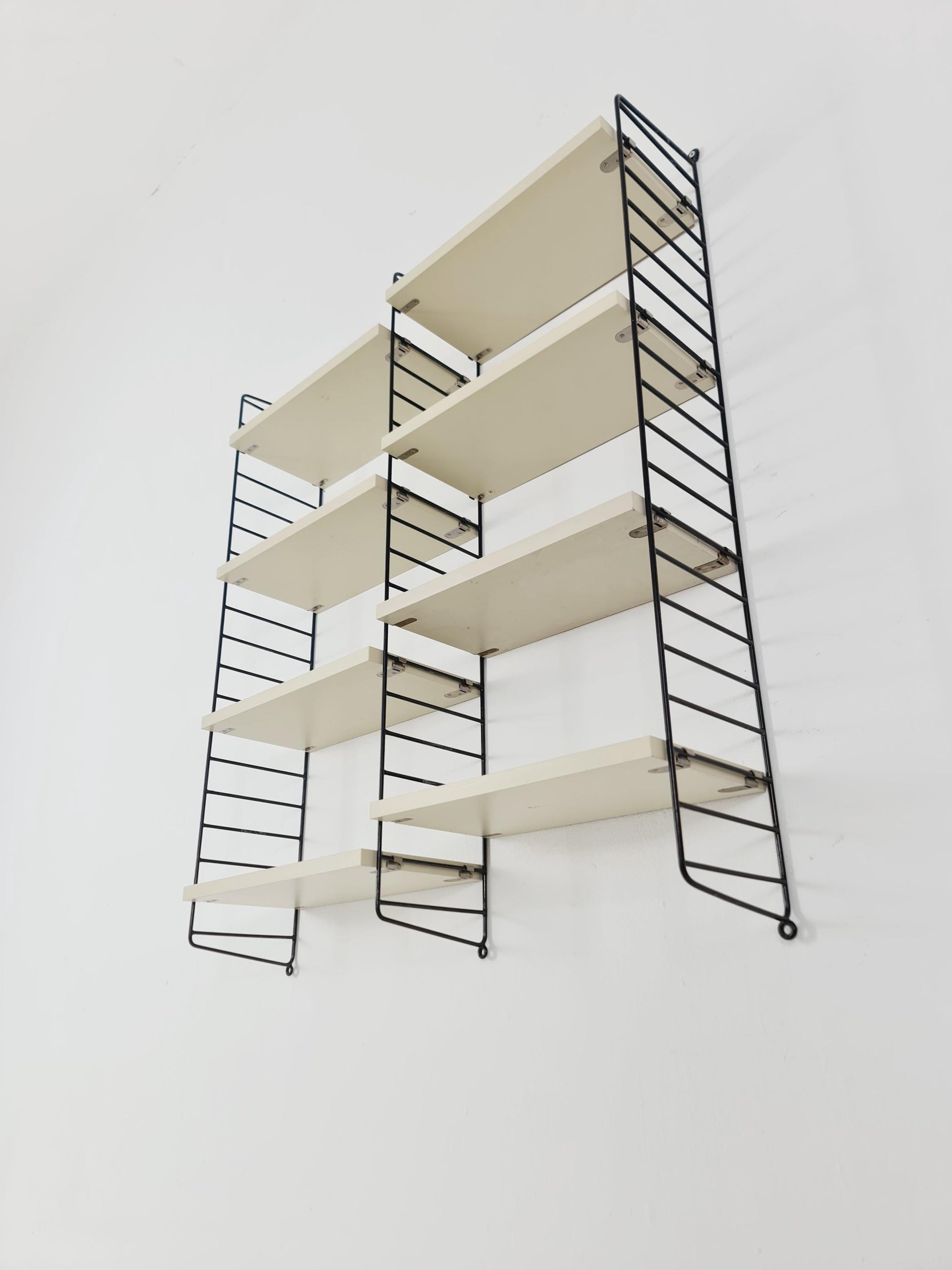 Original MCM wood shelving system - consists of black lacquered metal ladders, from string Stockholm 1960s