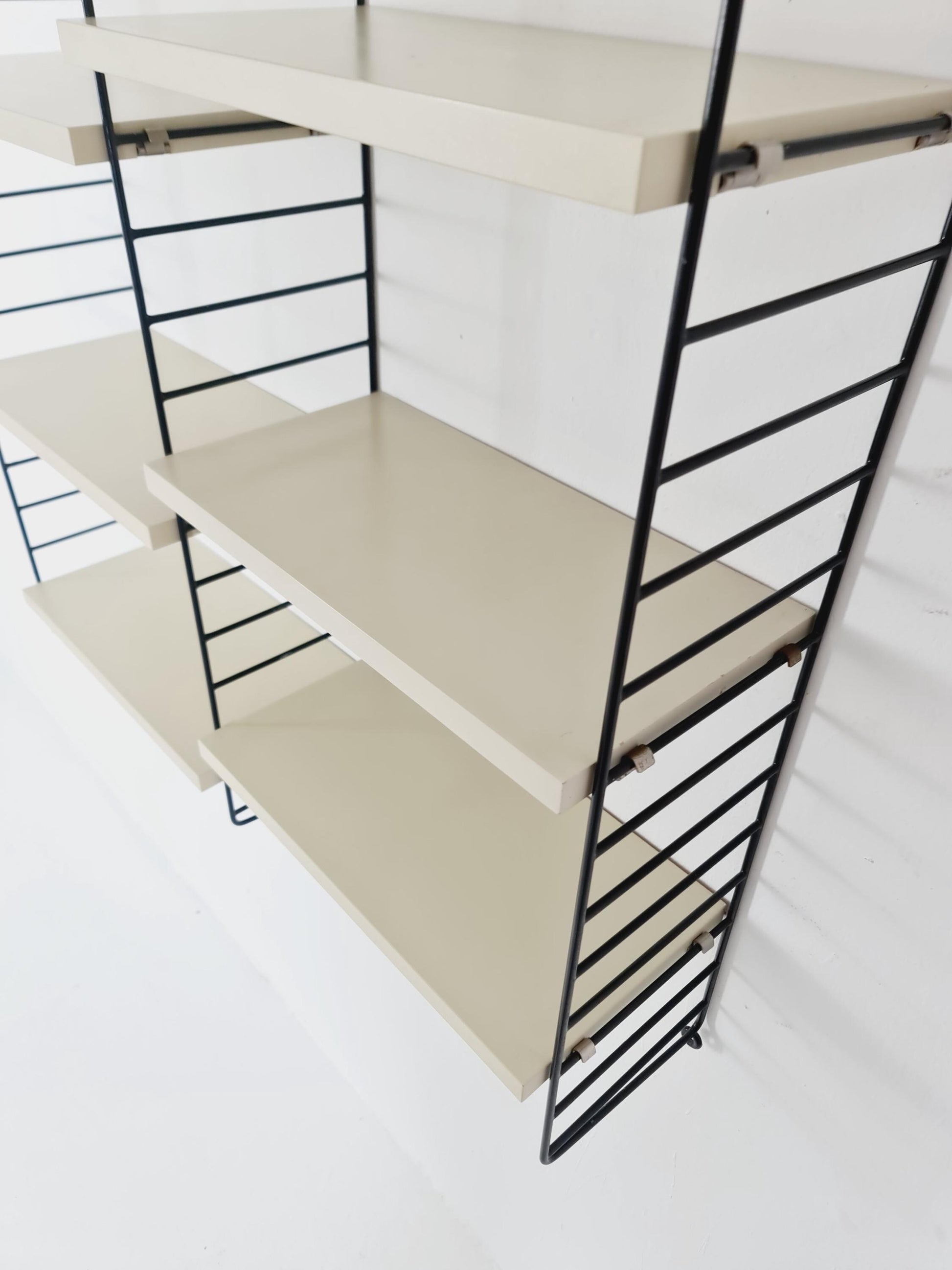 Original MCM wood shelving system - consists of black lacquered metal ladders, from string Stockholm 1960s