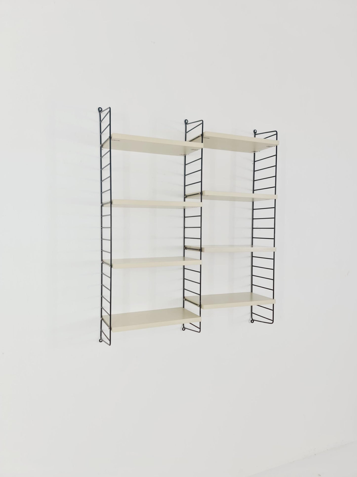 Original MCM wood shelving system - consists of black lacquered metal ladders, from string Stockholm 1960s