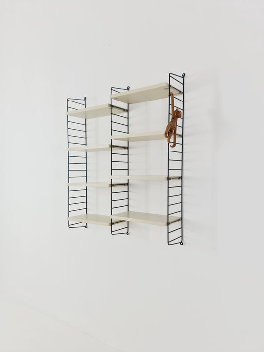Original MCM wood shelving system - consists of black lacquered metal ladders, from string Stockholm 1960s