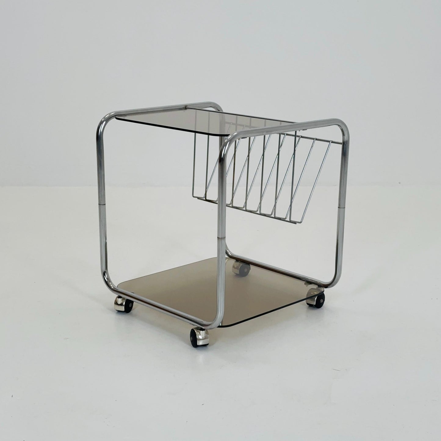 Mid century Chrome bar cart/serving trolley. magazine rack Smoked glass ,Bauhaus Germany 1980s