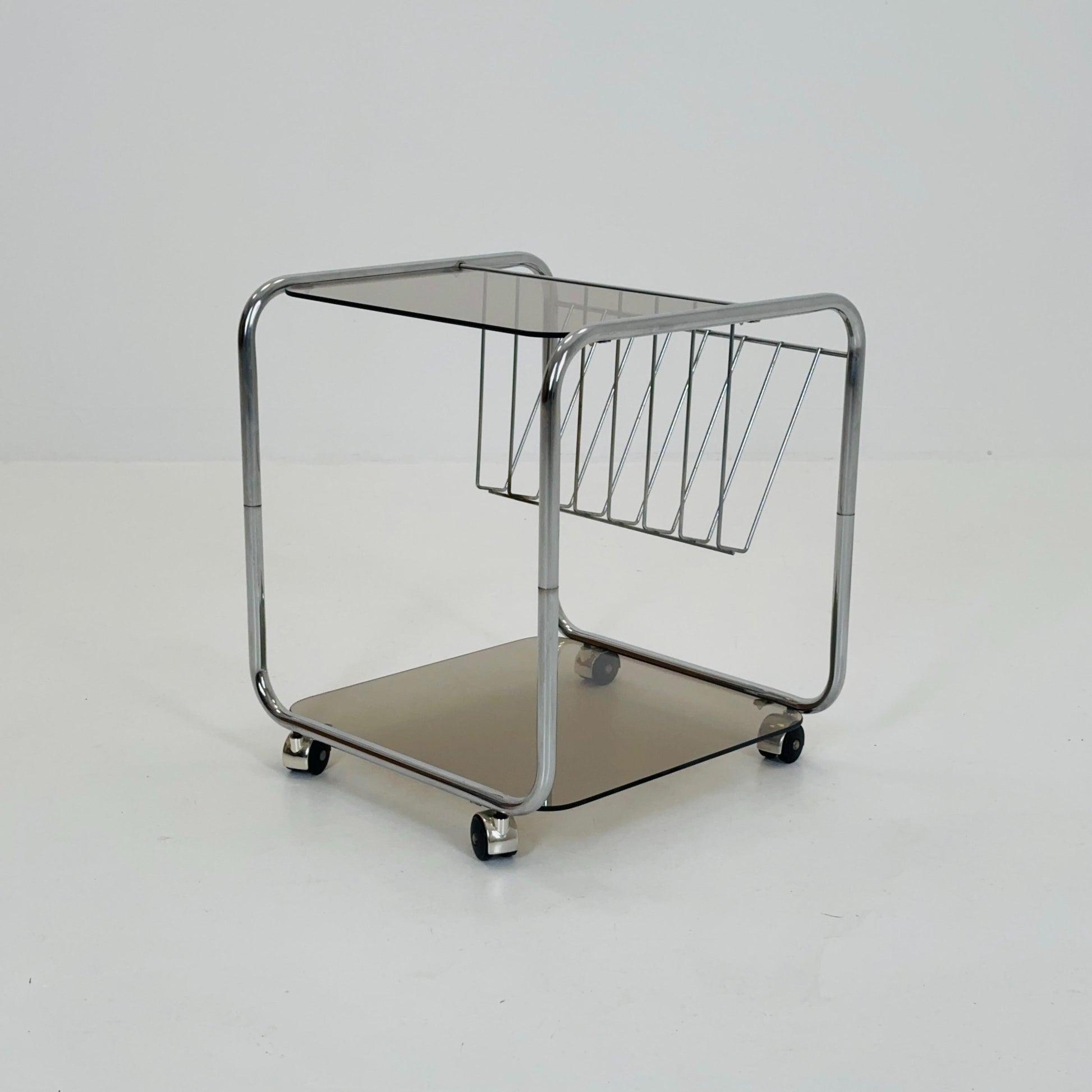 Mid century Chrome bar cart/serving trolley. magazine rack Smoked glass ,Bauhaus Germany 1980s