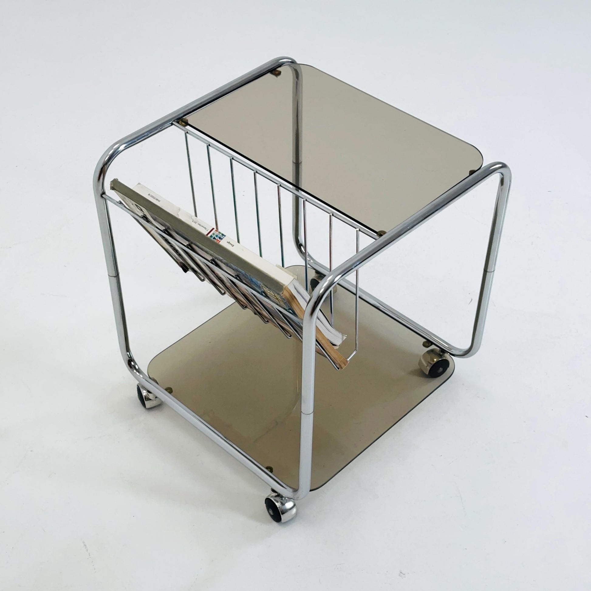 Mid century Chrome bar cart/serving trolley. magazine rack Smoked glass ,Bauhaus Germany 1980s