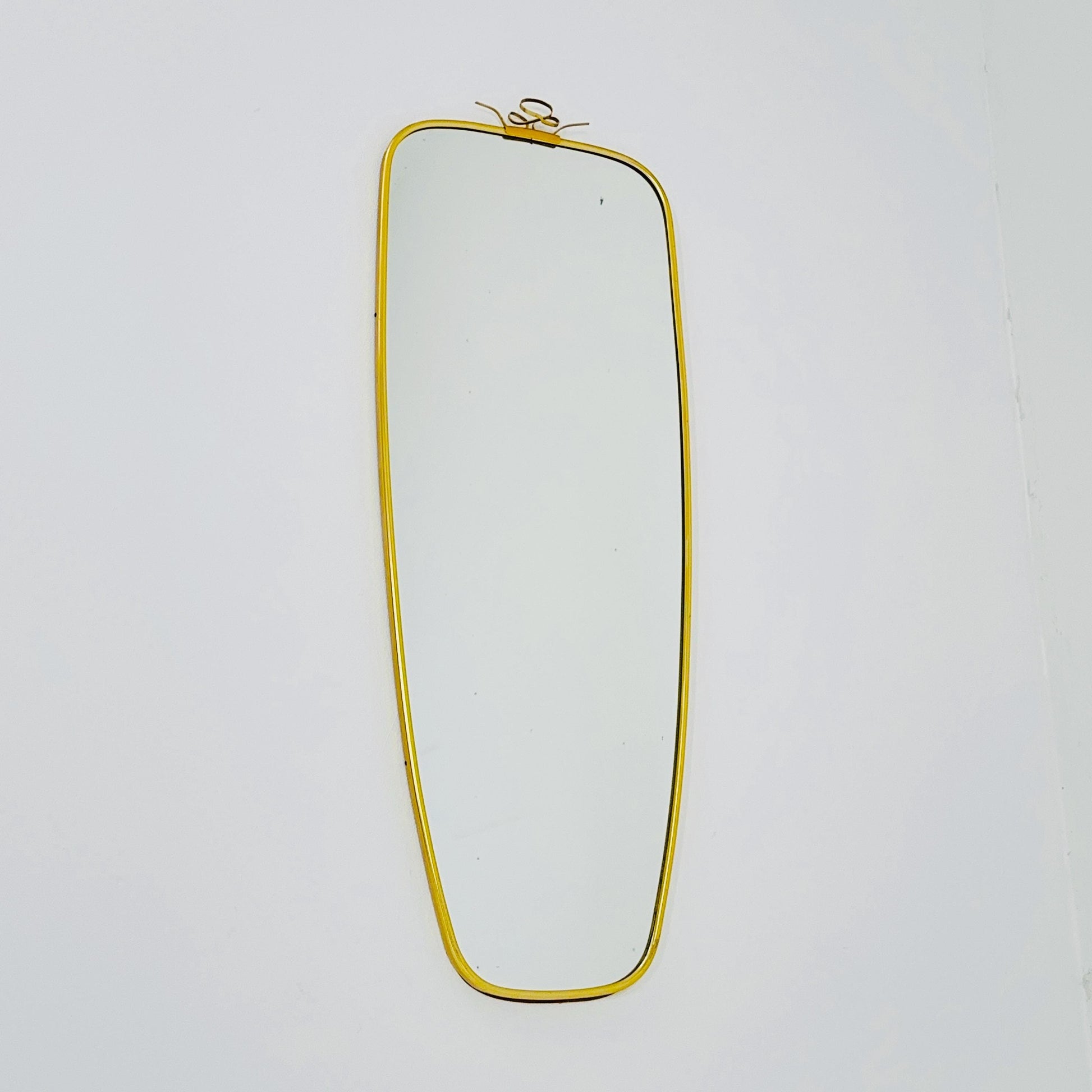 Mid Century asymmetric German brass Original kidney wall mirror from the 60s