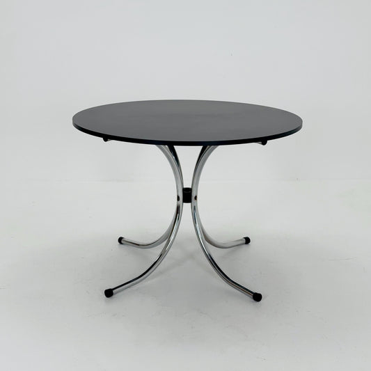 Mid-century dinning round table in chrome-plated steel with round solid black top, 1980s Italy