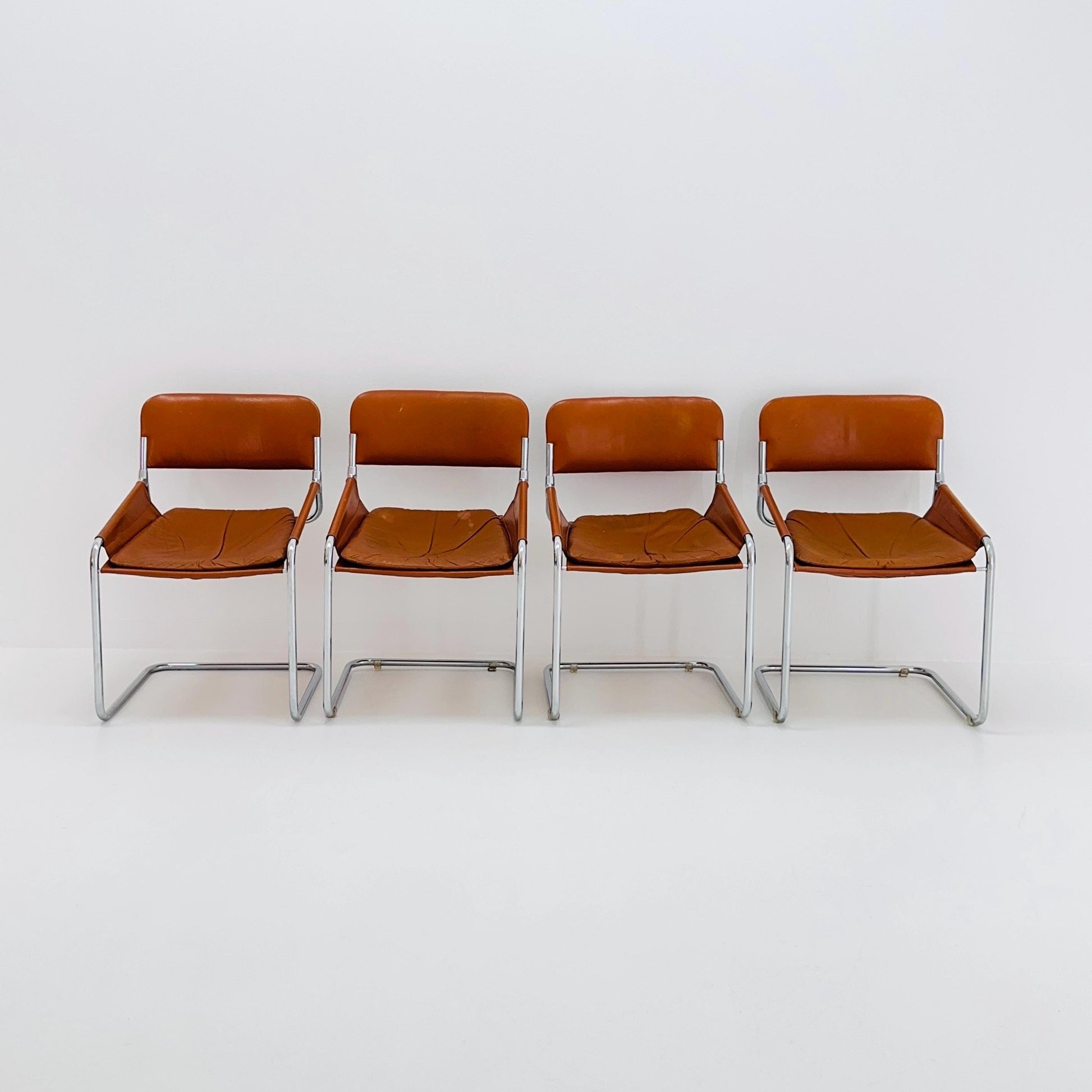 Set of 4 Mid century cognac leather & chrome tubular sling chair, Italy 1970