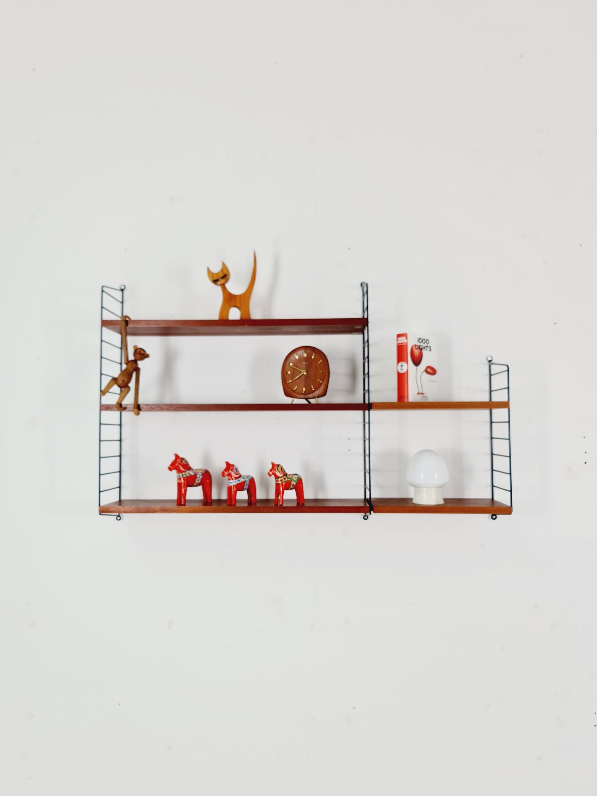 Original MCM Teak shelving system - consists of black lacquered metal ladders, from string Stockholm 1960s