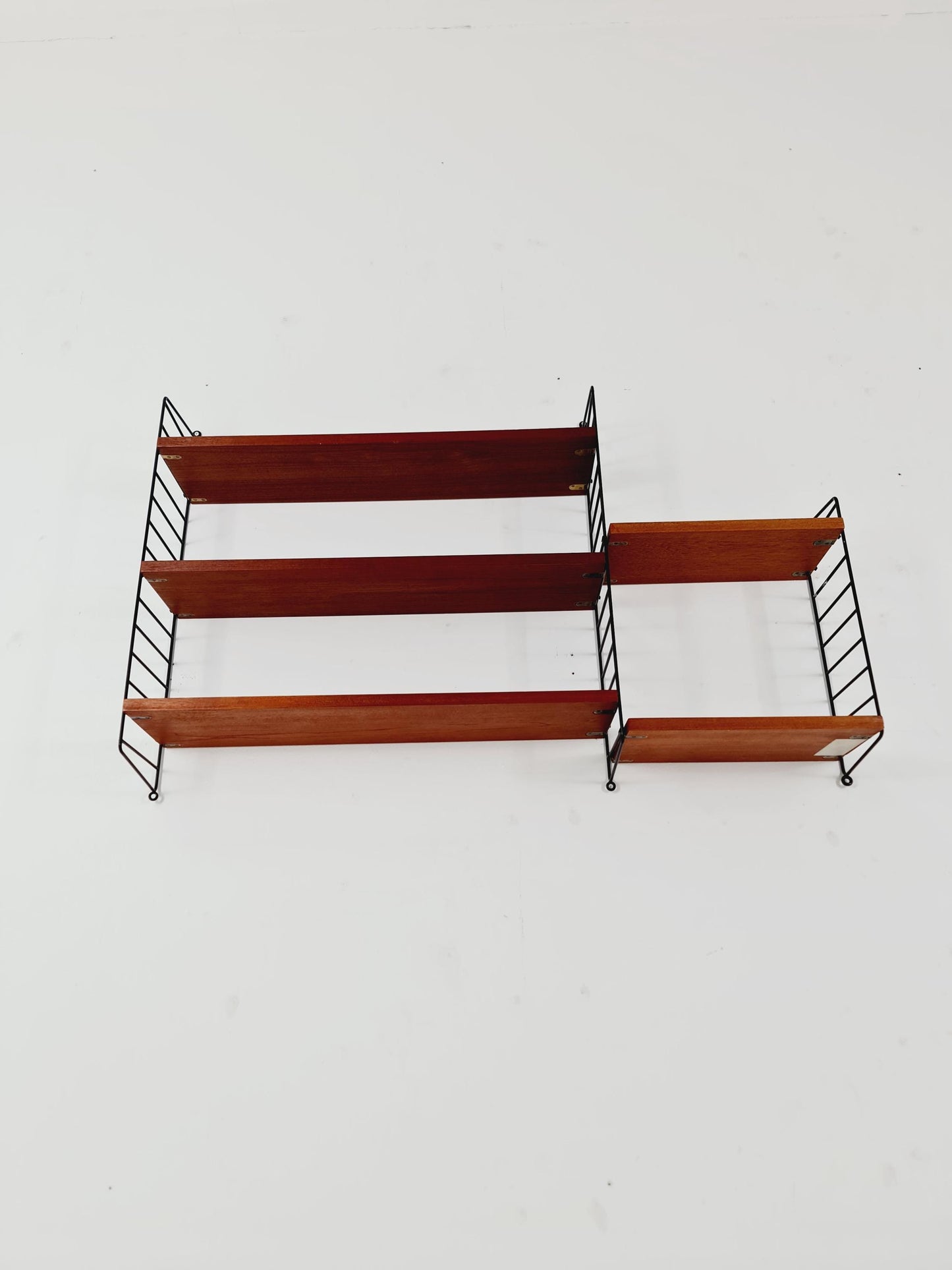 Original MCM Teak shelving system - consists of black lacquered metal ladders, from string Stockholm 1960s