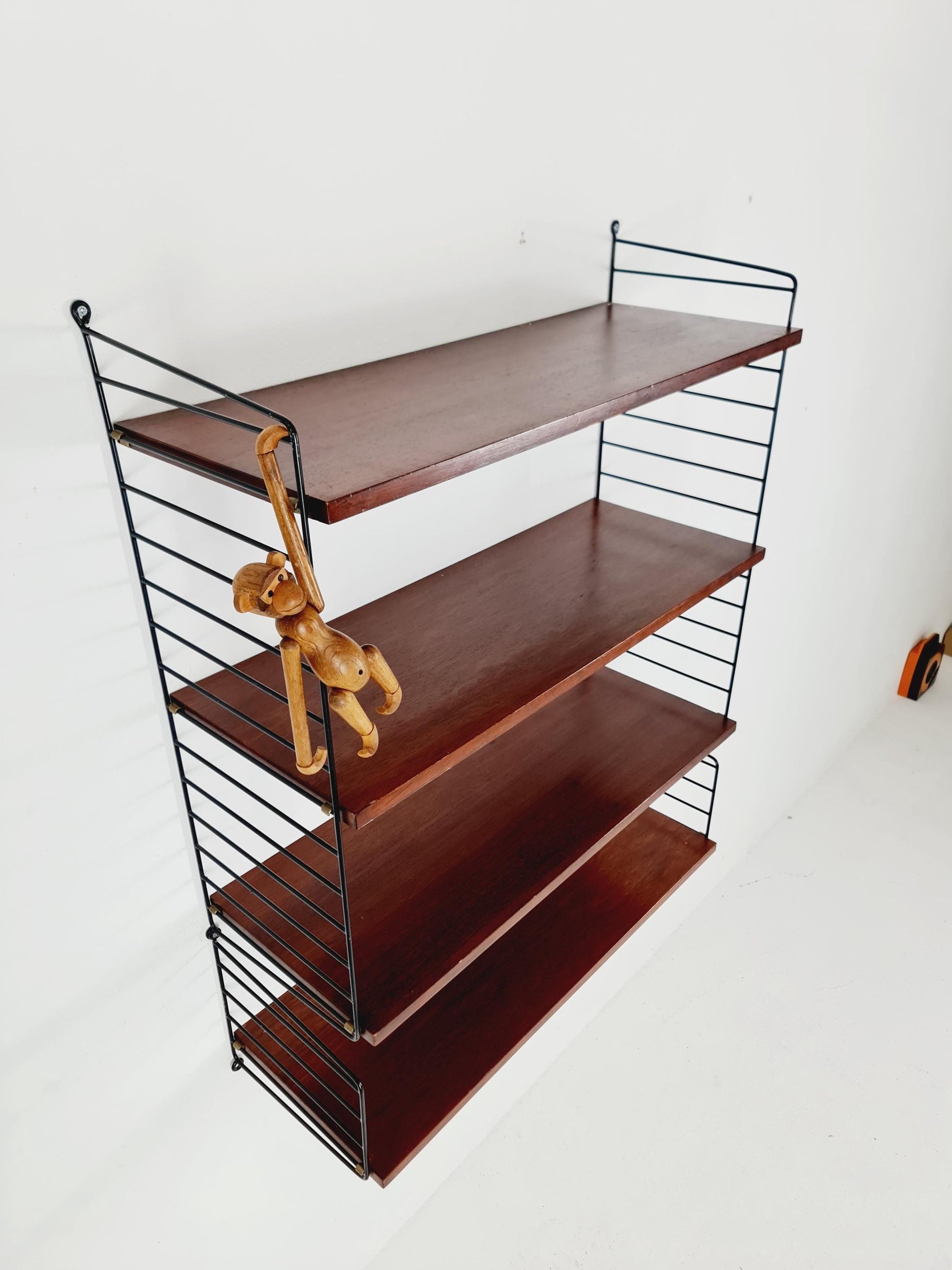 Original MCM Teak shelving system - consists of black lacquered metal ladders, from string Stockholm 1960s