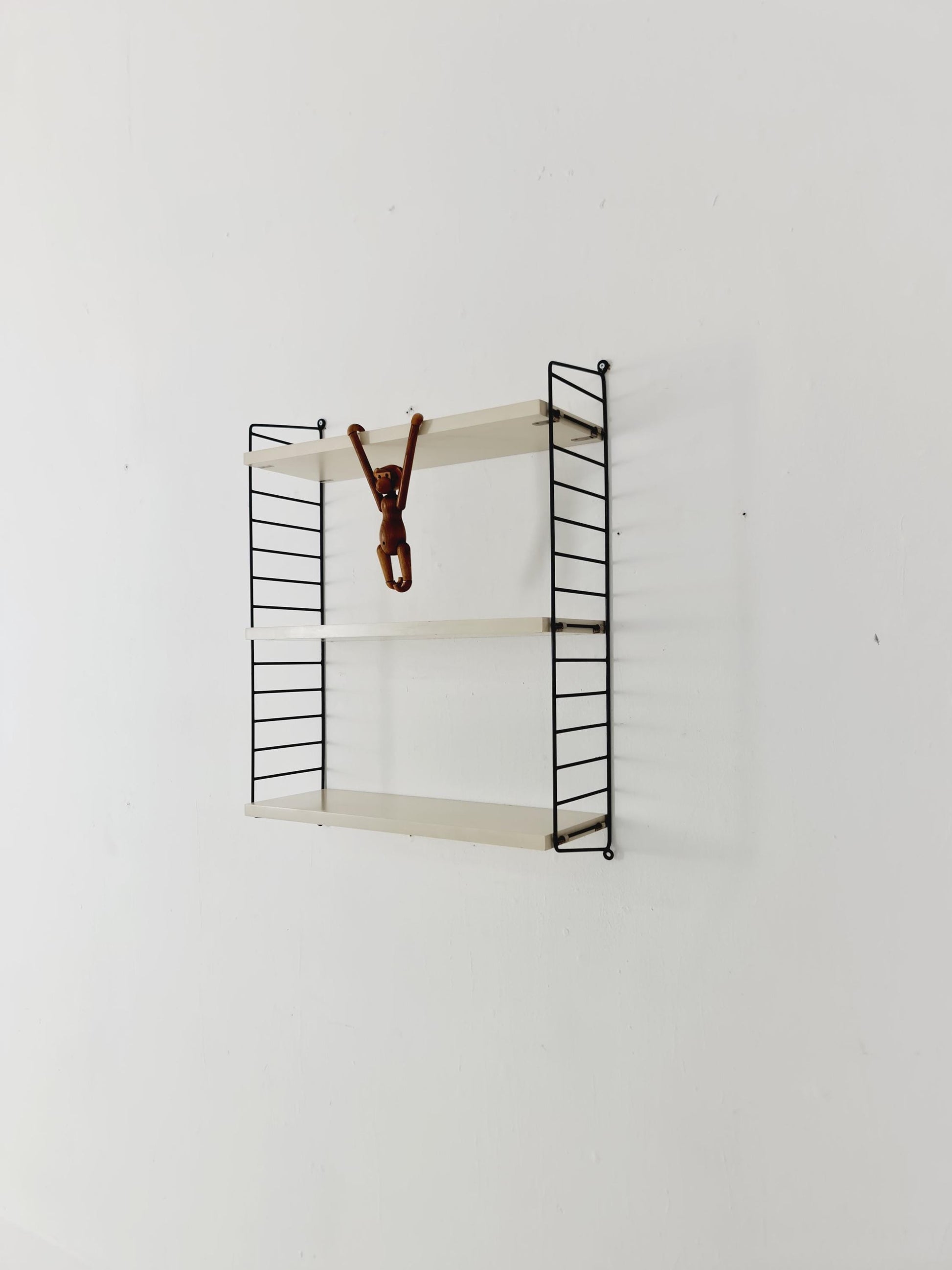 Original MCM wood shelving system - consists of black lacquered metal ladders, from string Stockholm 1960s