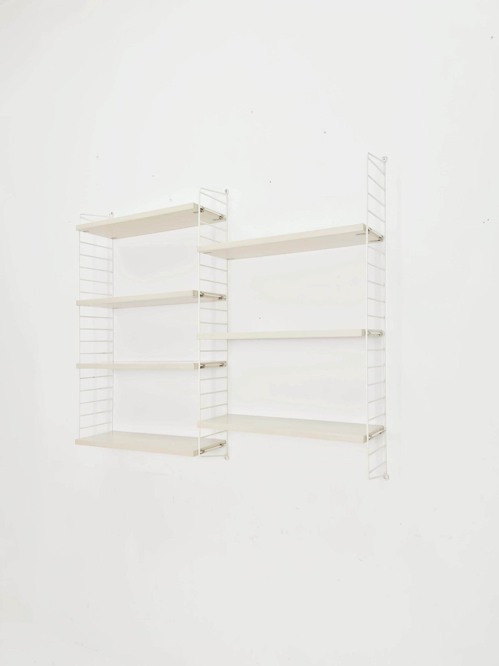 Original MCM wood shelving system - consists of black lacquered metal ladders, from string Stockholm 1960s