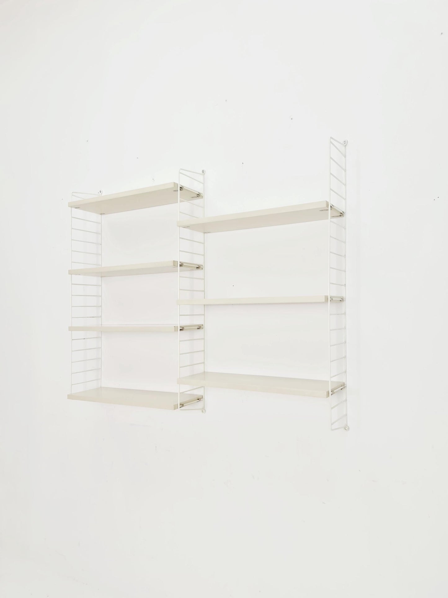 Original MCM wood shelving system - consists of black lacquered metal ladders, from string Stockholm 1960s