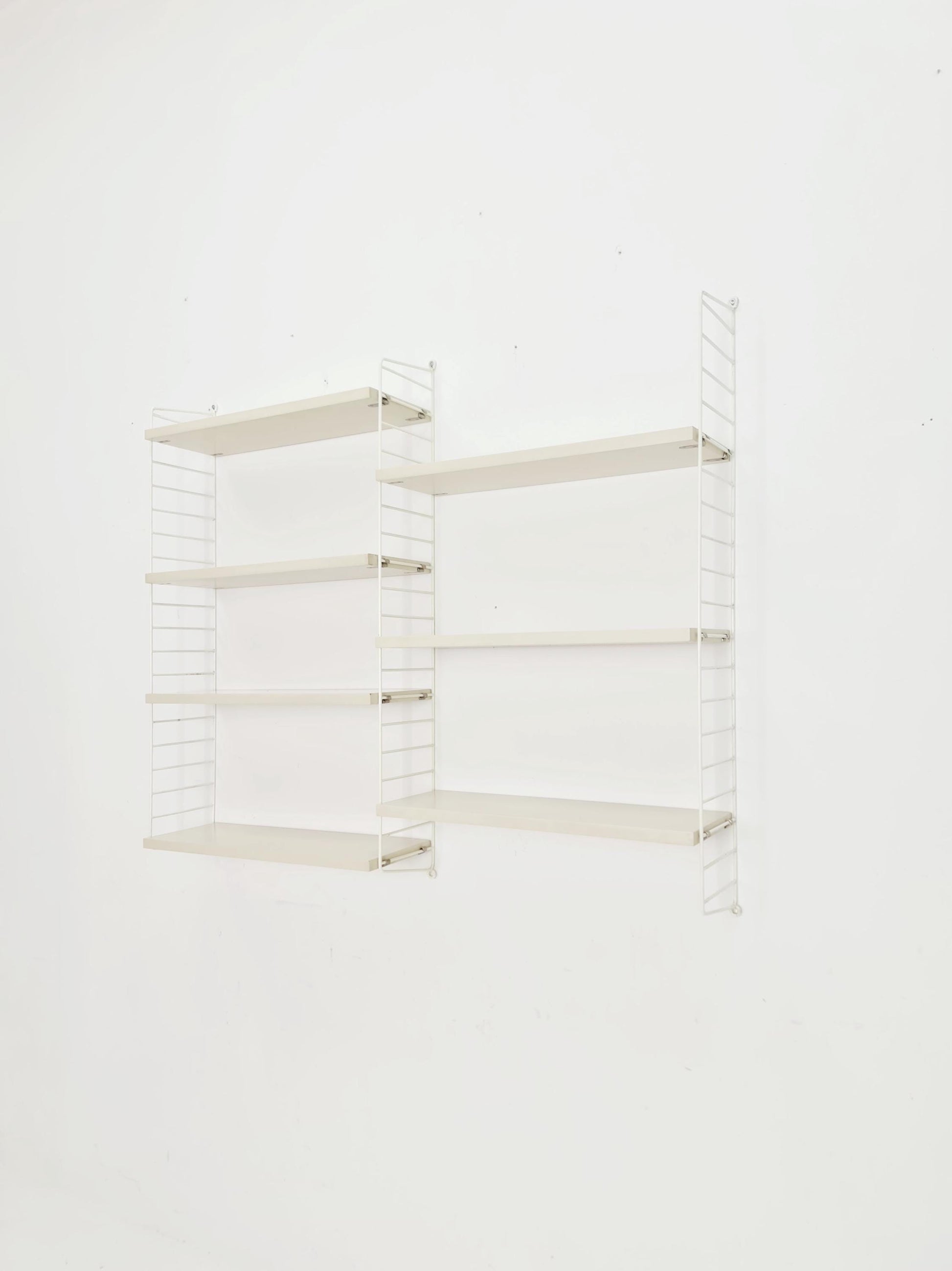 Original MCM wood shelving system - consists of black lacquered metal ladders, from string Stockholm 1960s