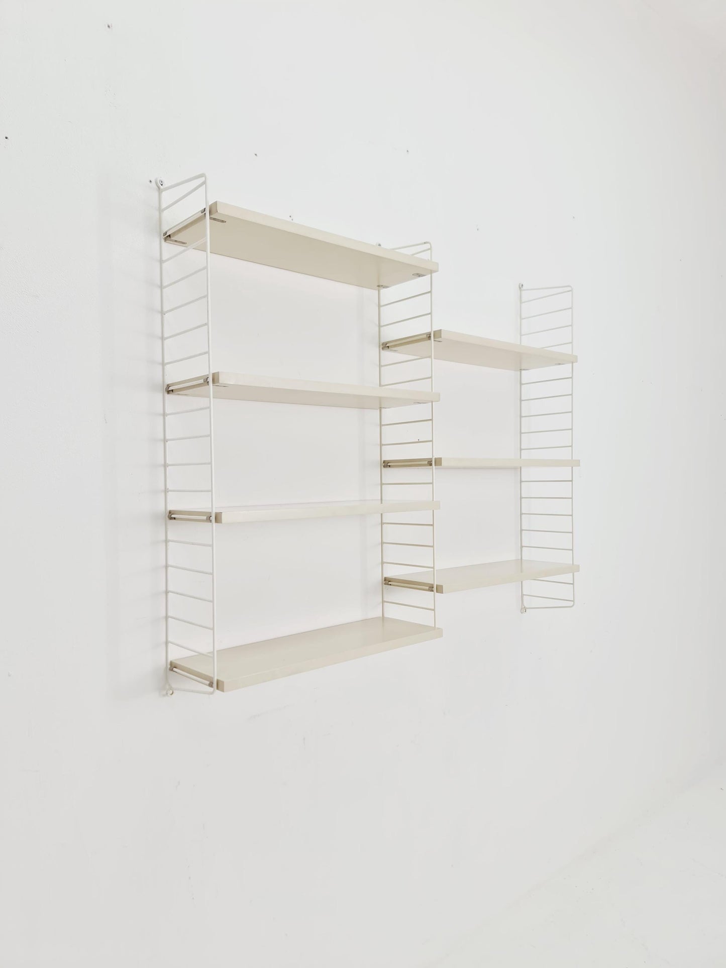 Original MCM wood shelving system - consists of black lacquered metal ladders, from string Stockholm 1960s