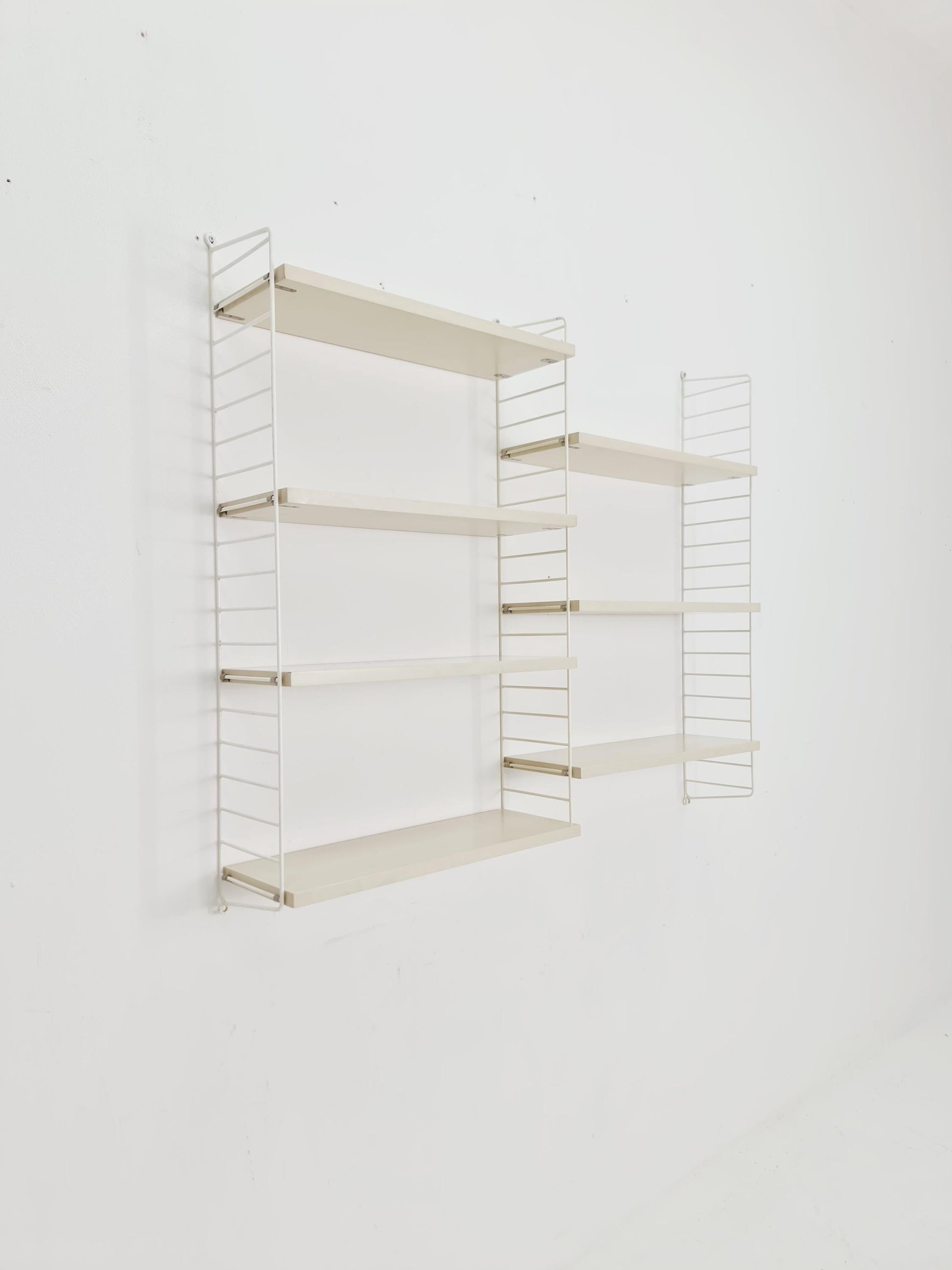 Original MCM wood shelving system - consists of black lacquered metal ladders, from string Stockholm 1960s