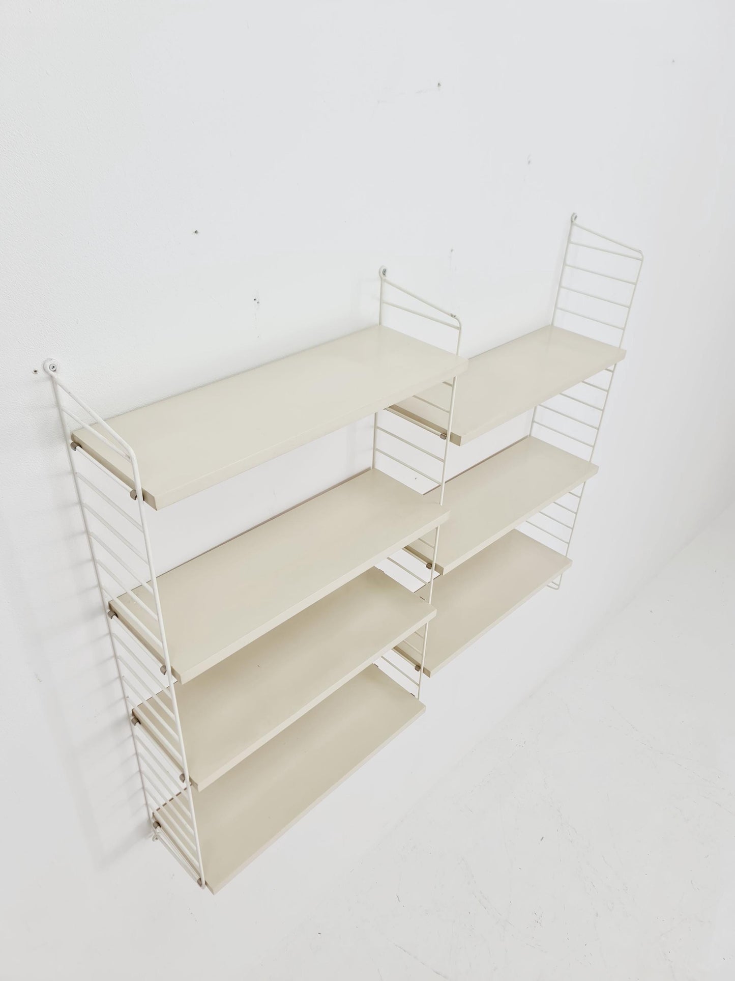 Original MCM wood shelving system - consists of black lacquered metal ladders, from string Stockholm 1960s