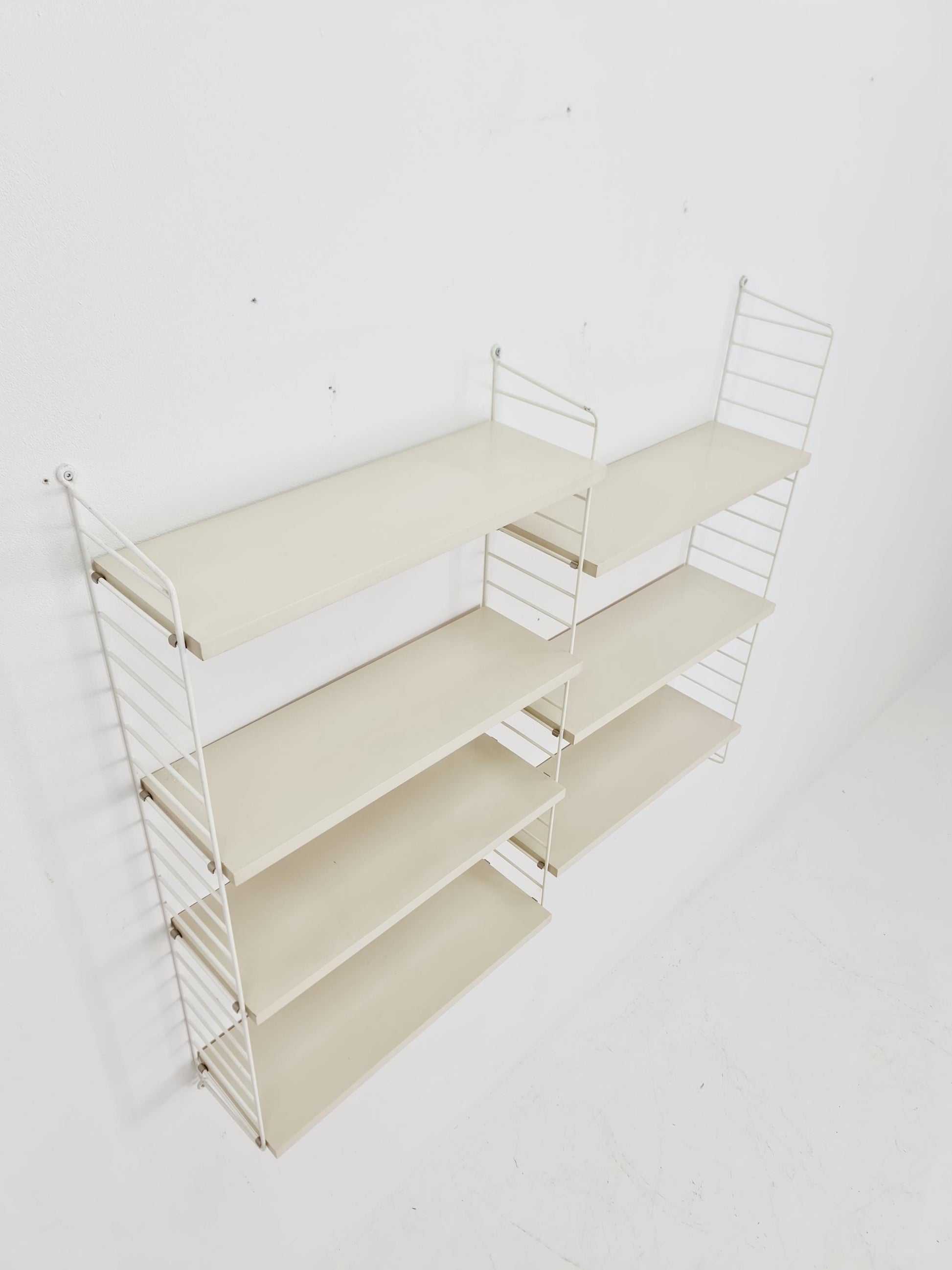 Original MCM wood shelving system - consists of black lacquered metal ladders, from string Stockholm 1960s