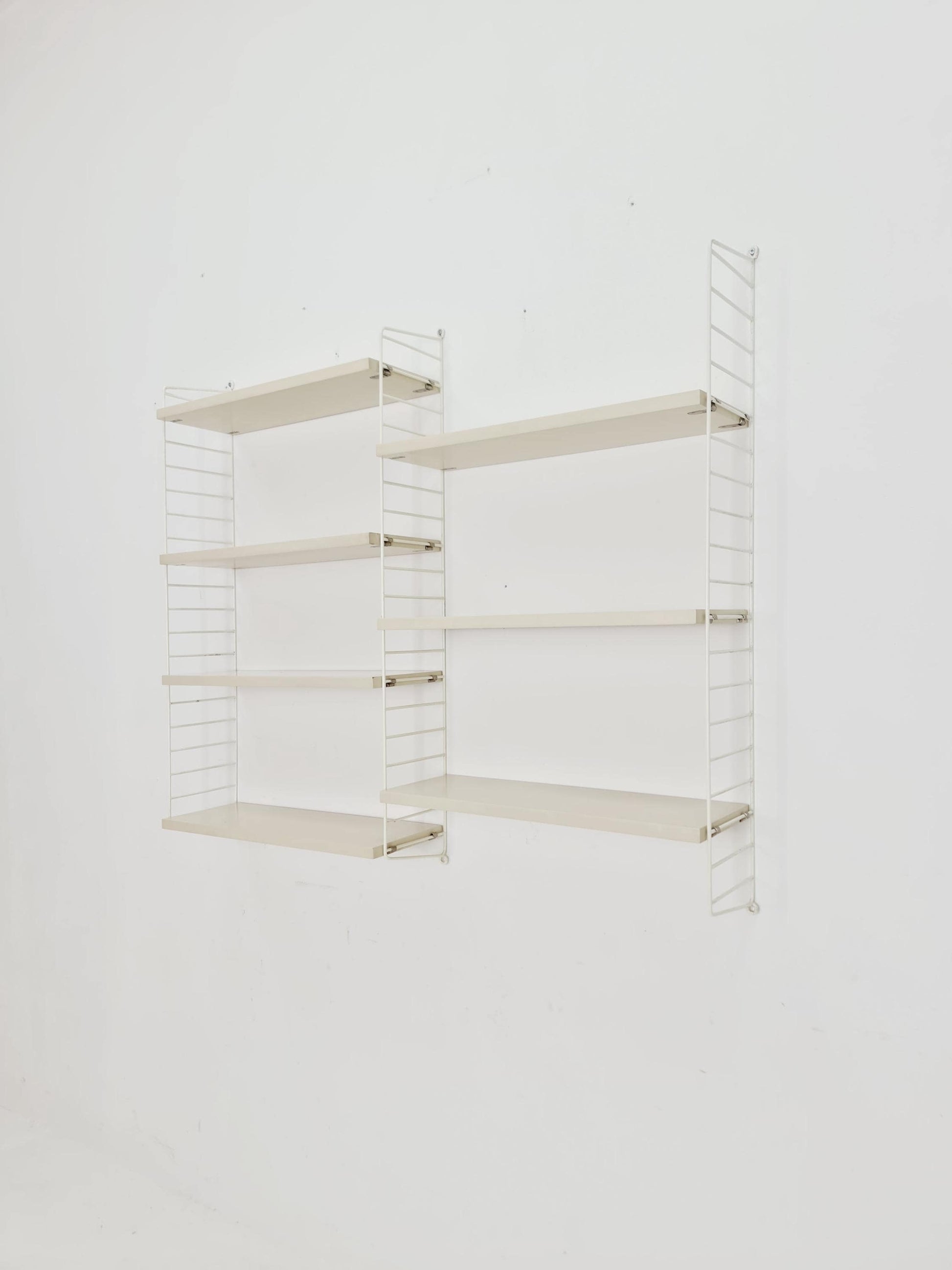Original MCM wood shelving system - consists of black lacquered metal ladders, from string Stockholm 1960s