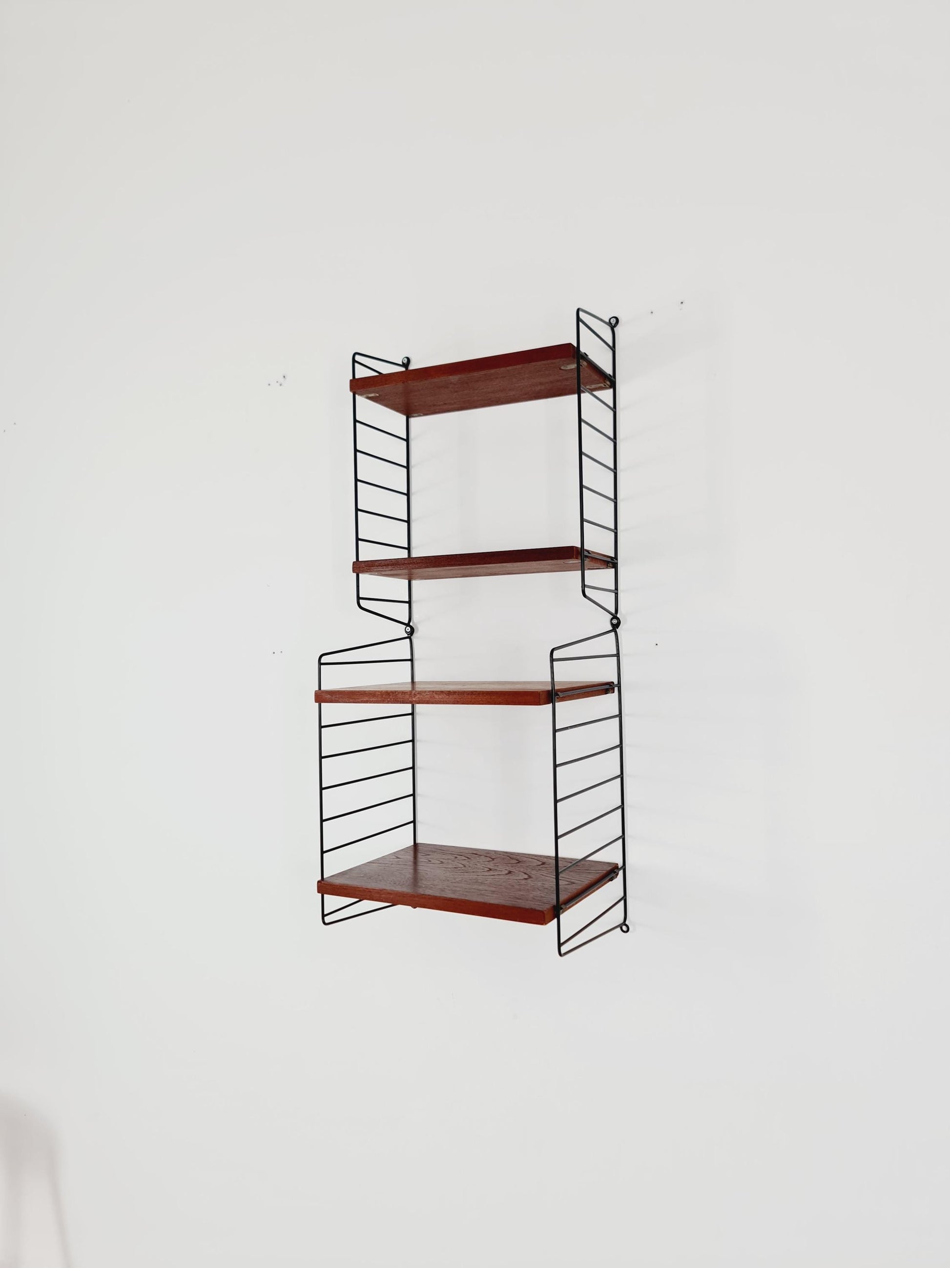 Original MCM Teak shelving system - consists of Black lacquered metal ladders, from string Stockholm 1960s