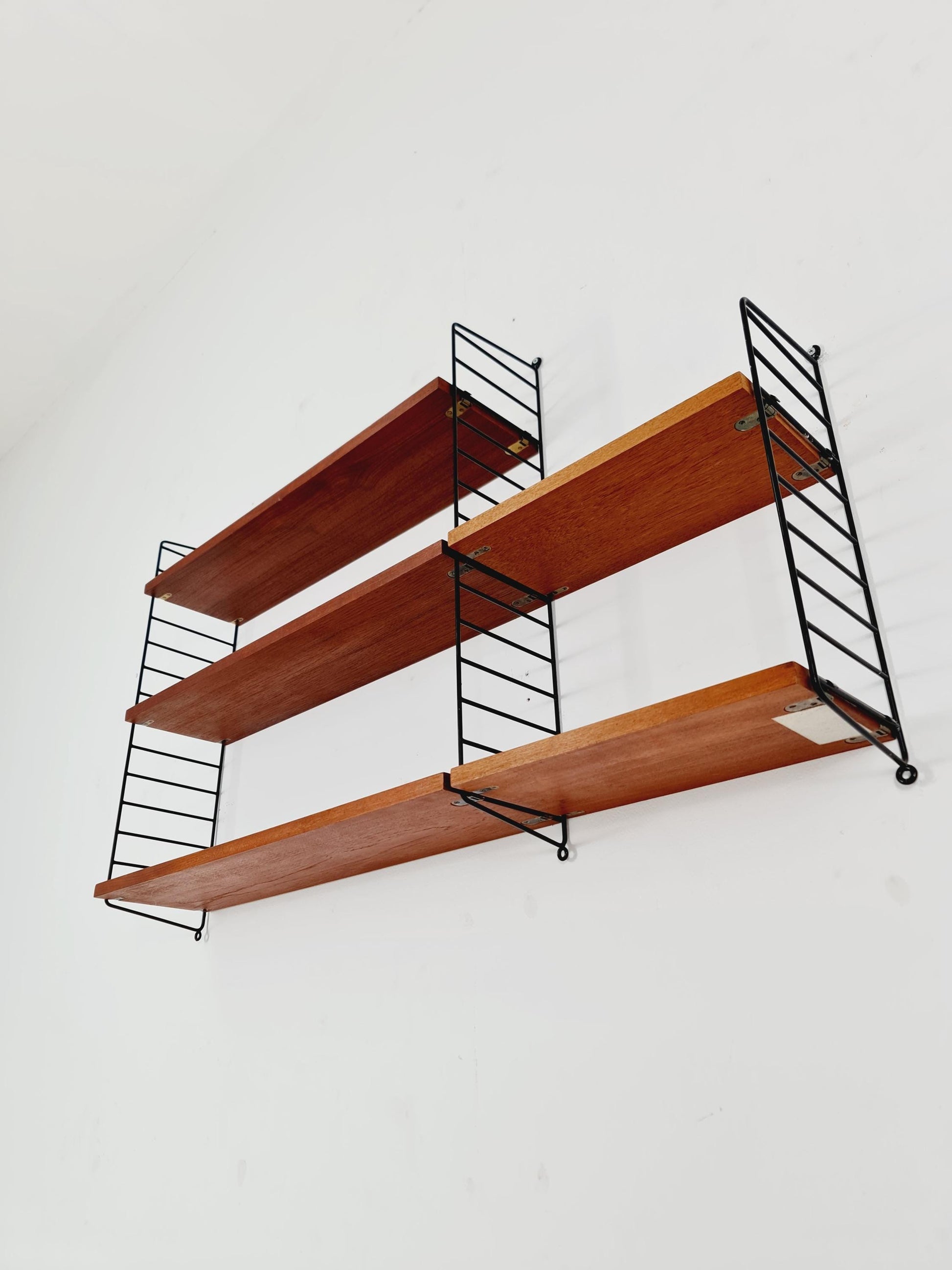 Original MCM Teak shelving system - consists of black lacquered metal ladders, from string Stockholm 1960s