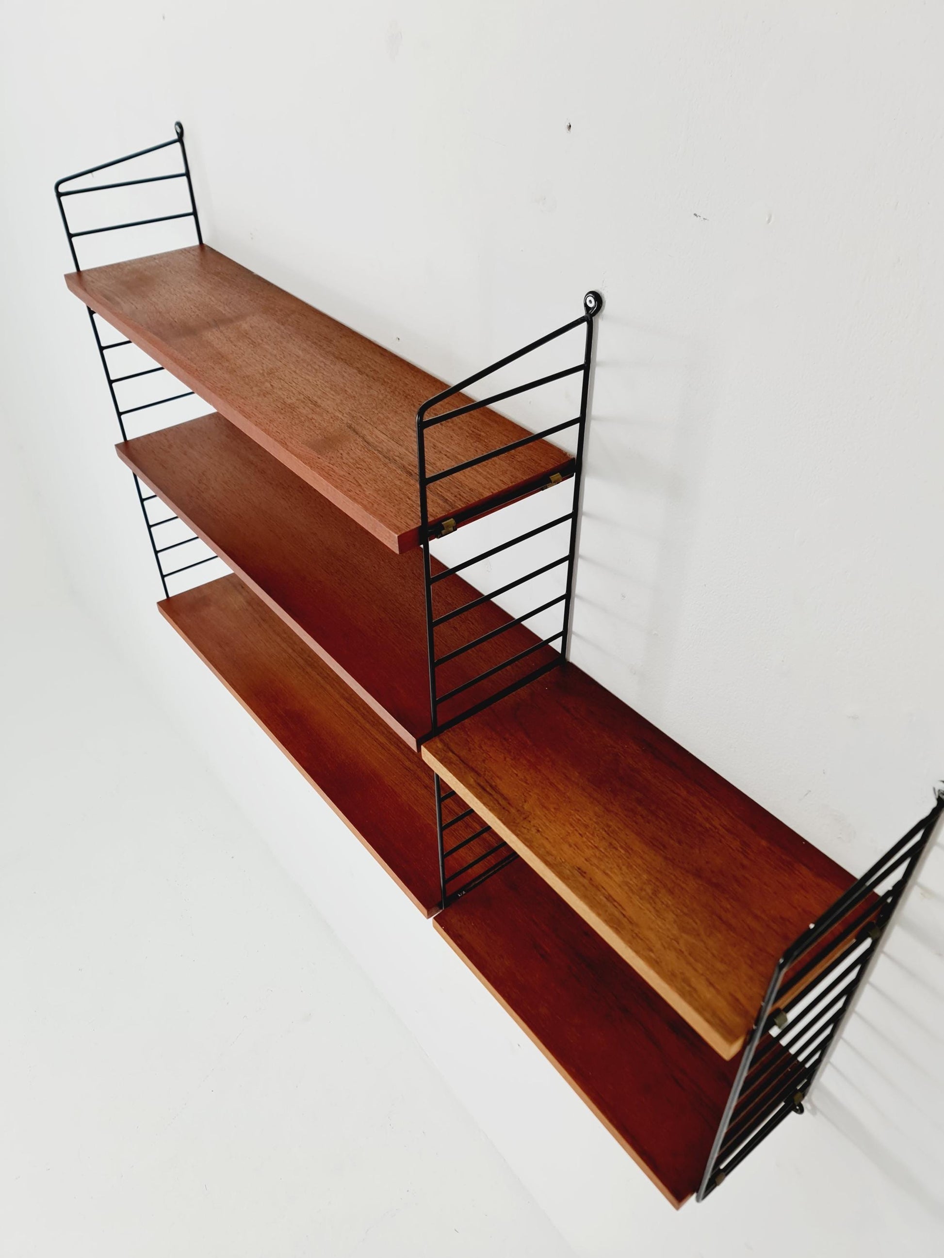 Original MCM Teak shelving system - consists of black lacquered metal ladders, from string Stockholm 1960s