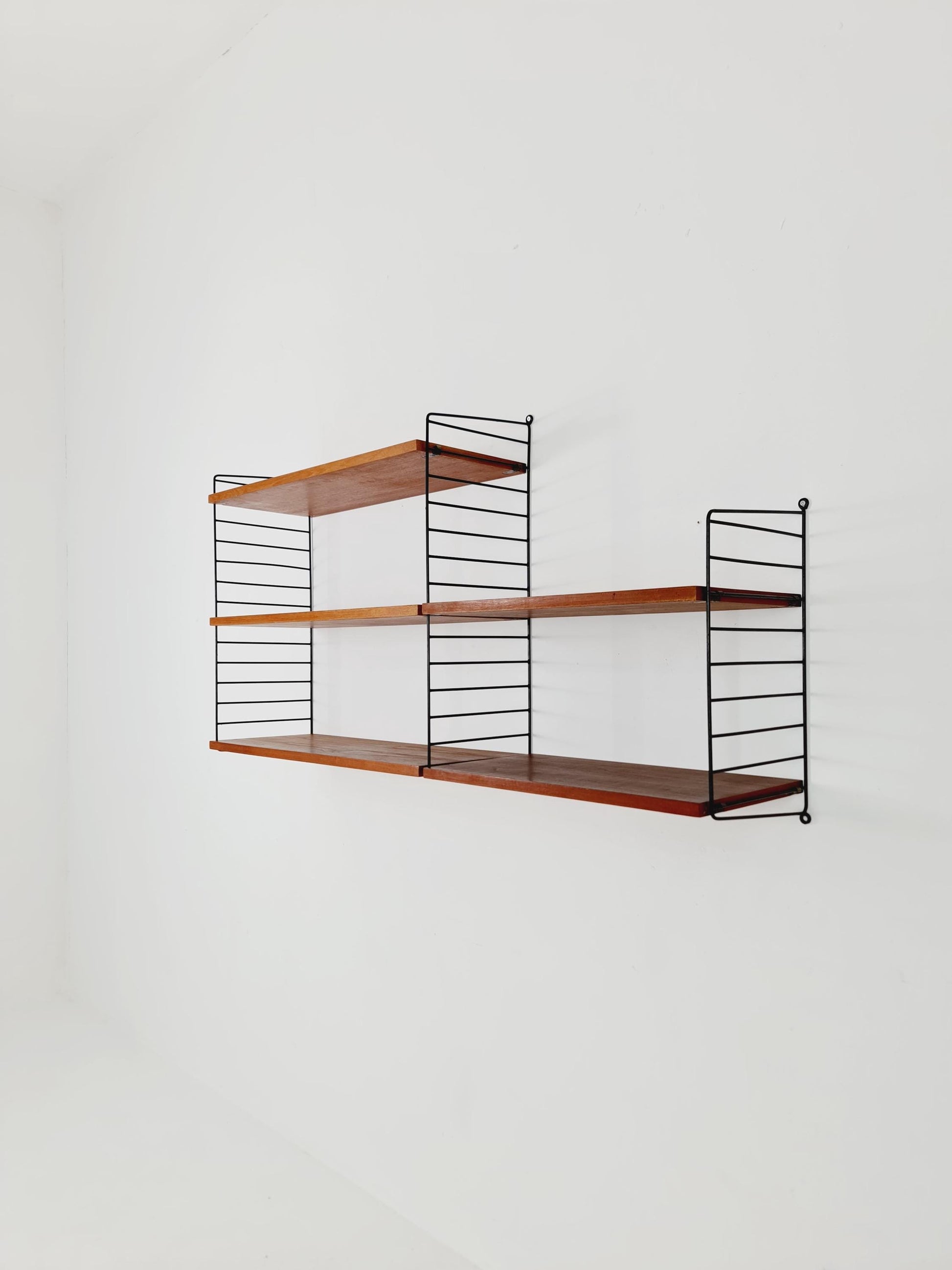 Original MCM Teak shelving system - consists of Black lacquered metal ladders, from string Stockholm 1960s